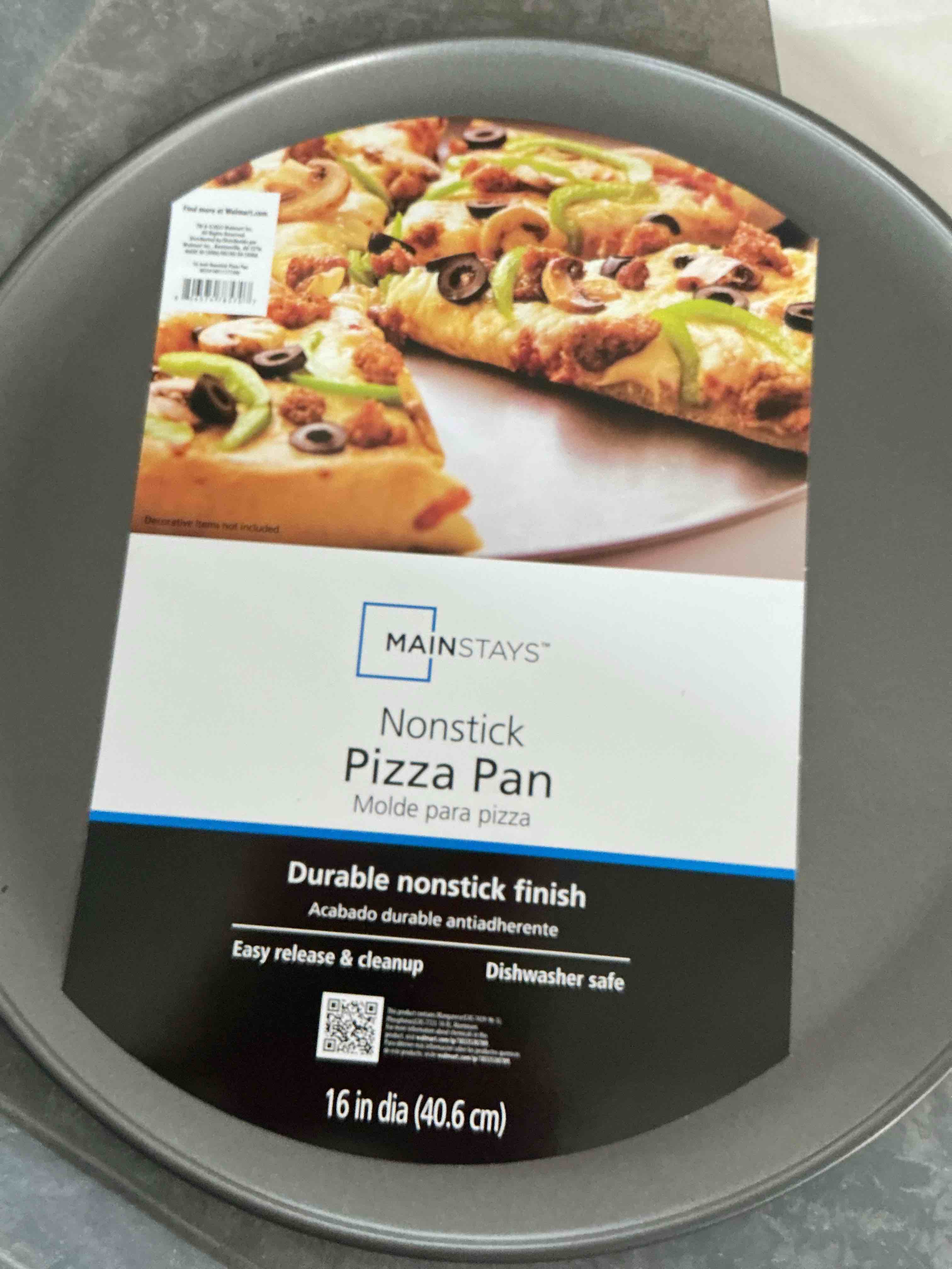 Condition photo showing New/Like New for mainstay kitchen non-stick pizza pan 1 pack – inch round carbon steel pizza tray with perforated holes, pfoapfosptfe-free, dishwasher & oven safe up to 450°f, durable nonstick silver coating