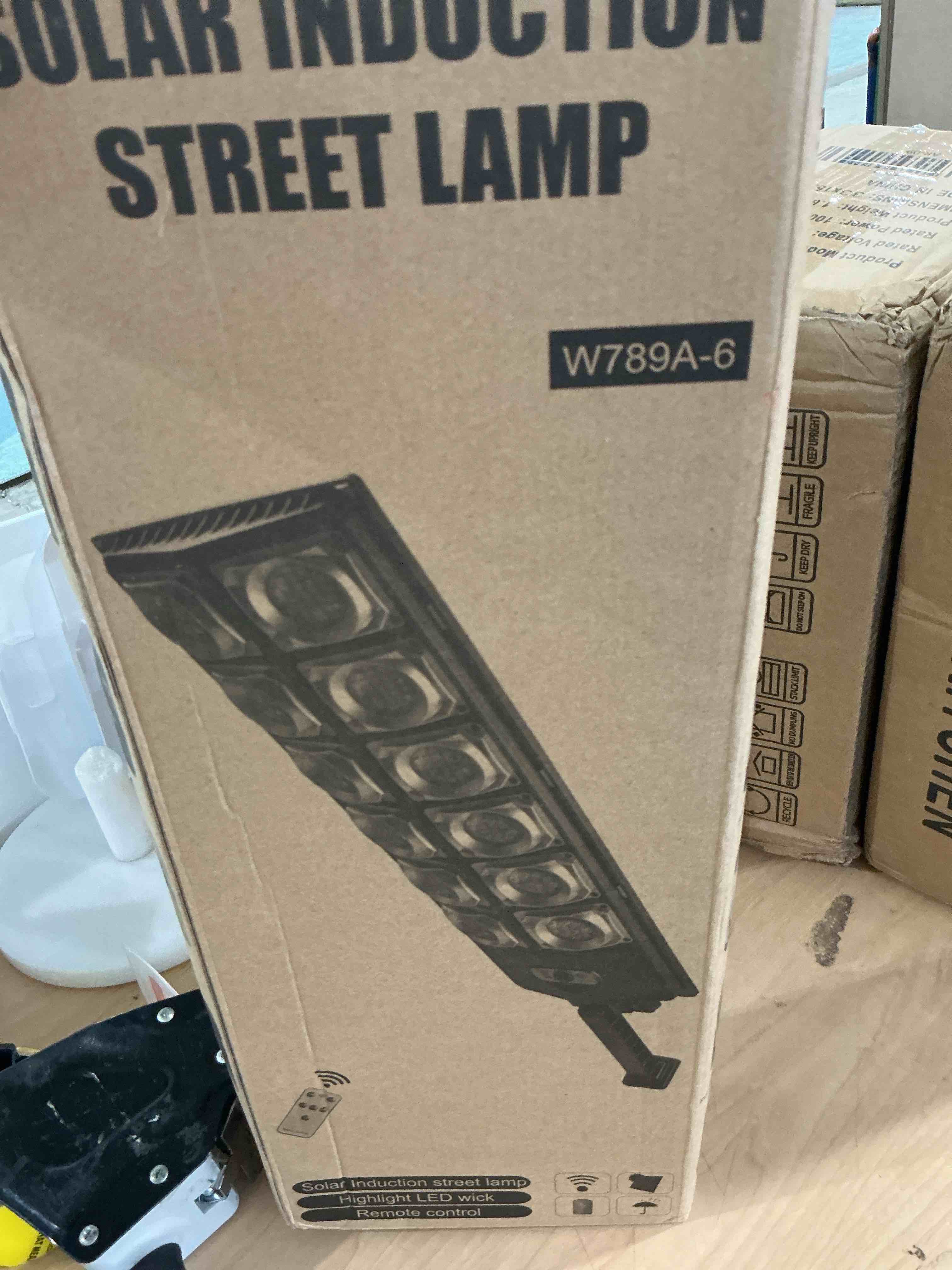 Condition photo showing New/Like New for wywna 9000w solar street light outdoor, 8000k motion sensor solar lights with remote, ip66 waterproof security light, 350° wide angle, dusk to dawn for parking lot yard farm (1)