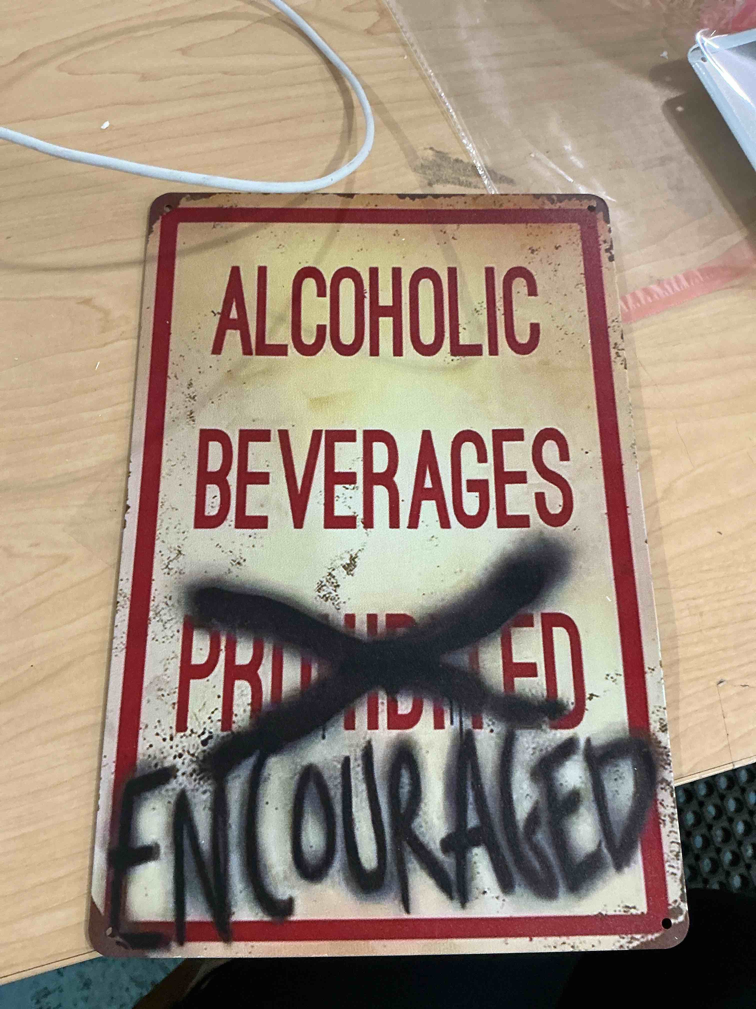 Condition photo showing New/Like New for desperate enterprises alcoholic beverages encouraged tin sign - nostalgic vintage metal wall decor - made in usa