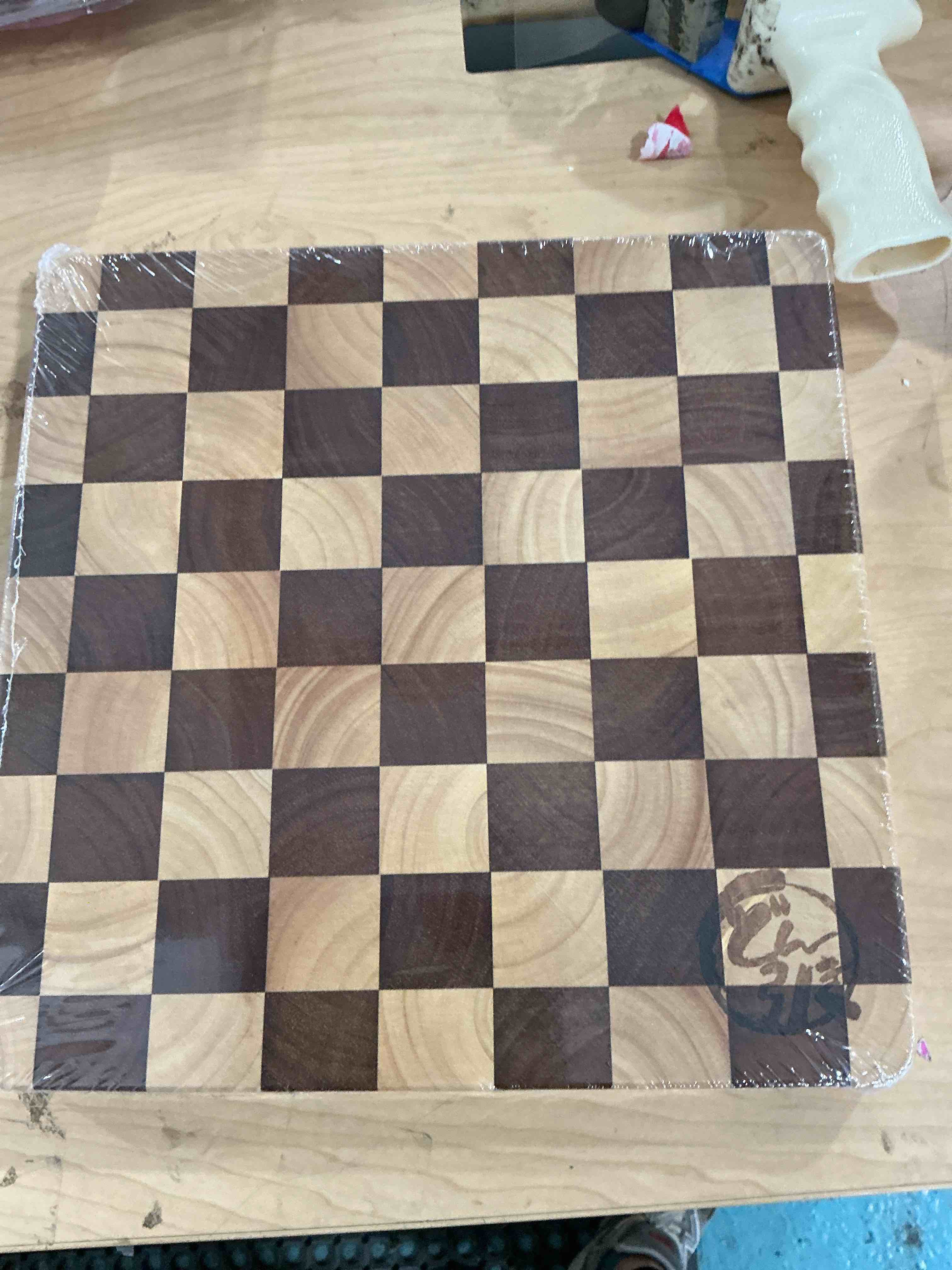 Condition photo showing New/Like New for checkered cutting board for kitchen, wooden chopping, cheese & charcuterie board in acacia wood, butcher block serving tray for meat, fruit, bread & vegetables