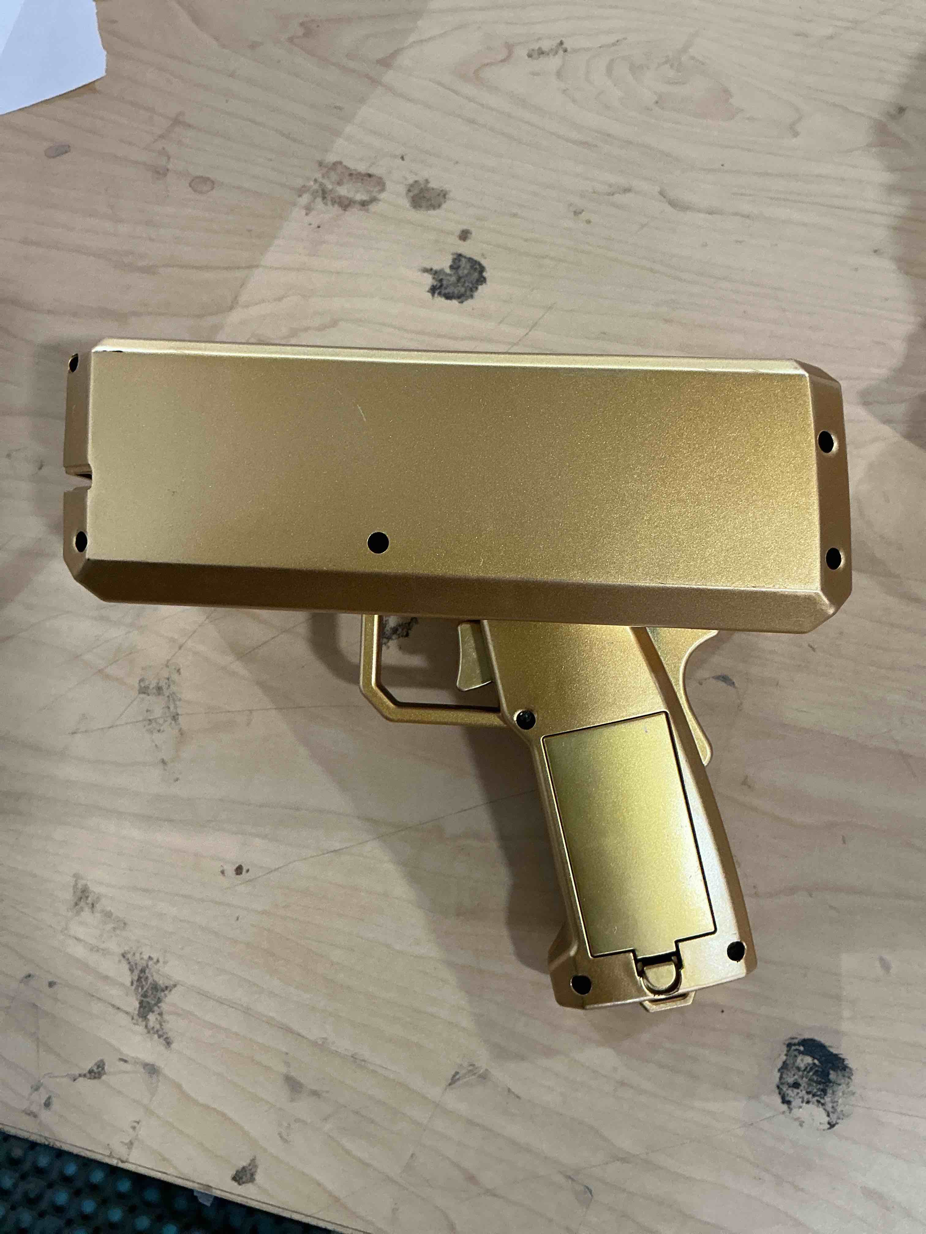 Condition photo showing Good Condition for gold money gun, automatic cash shooter toy make it rain money toy gun for parties, weddings, birthdays, club events fun prop money gun for real or fake bills, coupons & flyers for party