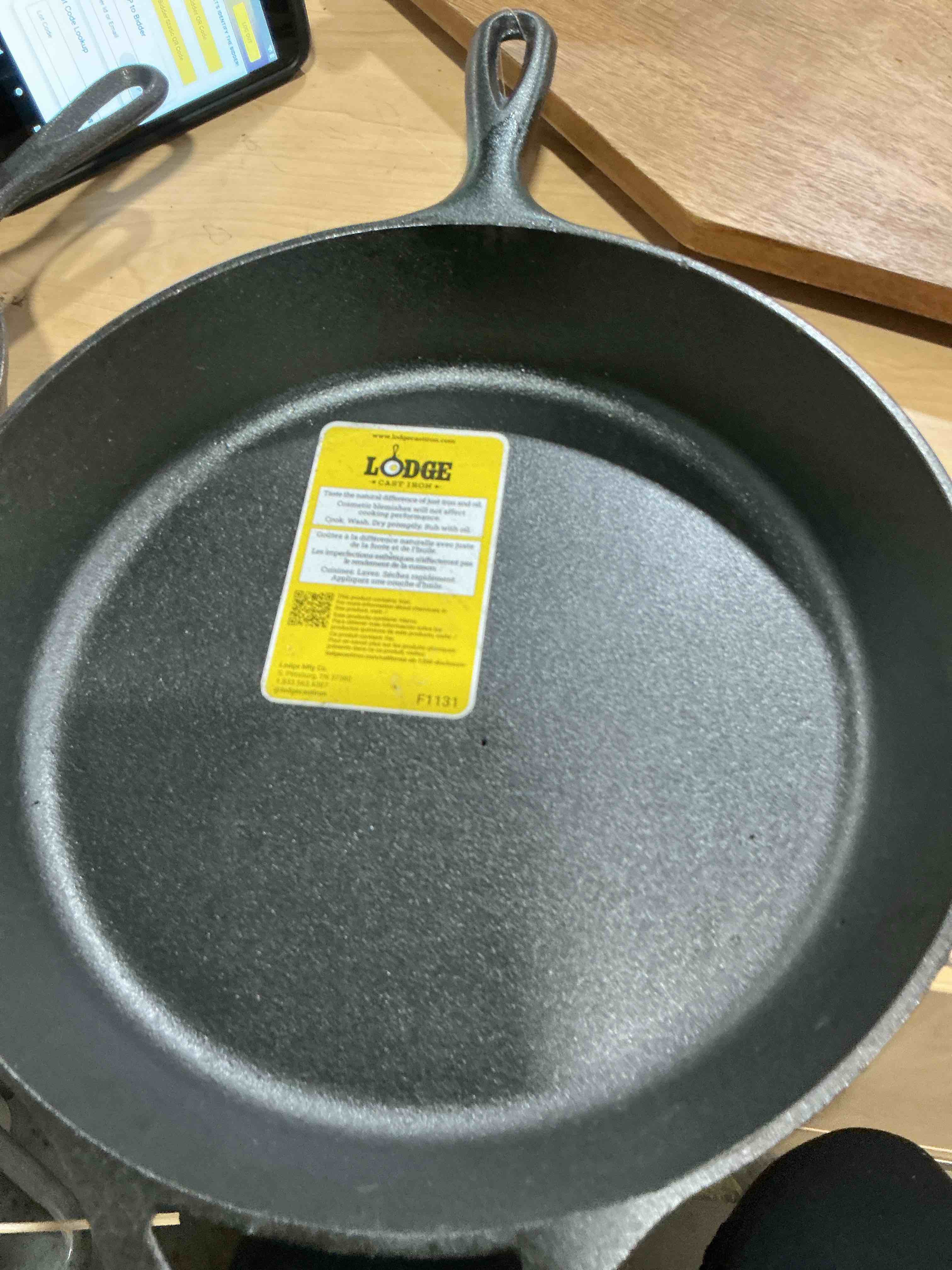 Condition photo showing New/Like New for lodge seasoned cast iron skillet 12 inches - quality frying pan for the stove, oven, grill & campfire - includes silicone hot handle holder - non-toxic, nonstick & long-lasting 12 inch + hot handle holder