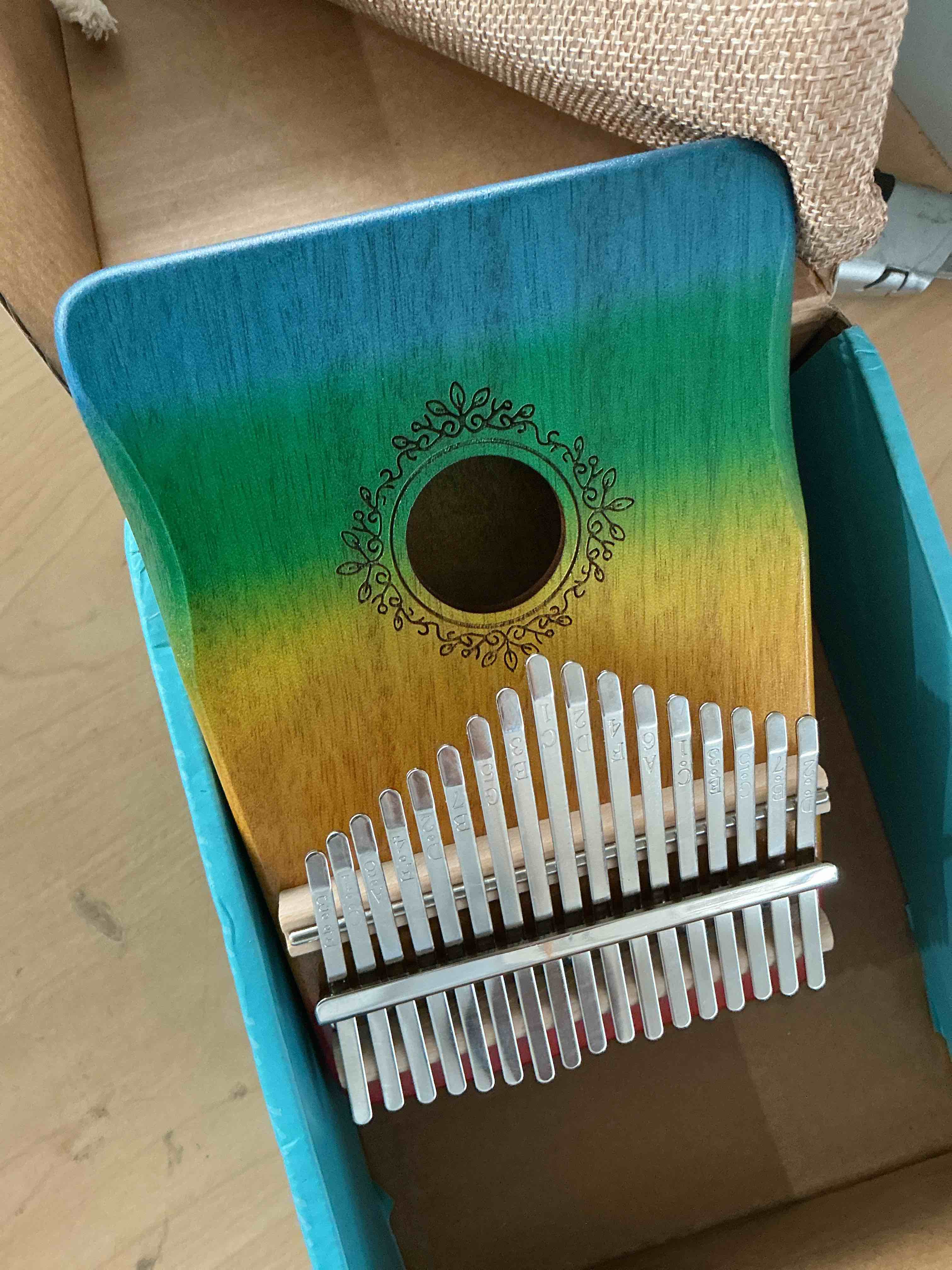 Condition photo showing New/Like New for noennkalimba portable mahogany piano 17 key musical instrument with tuning mallet, hammer, colorful gradient