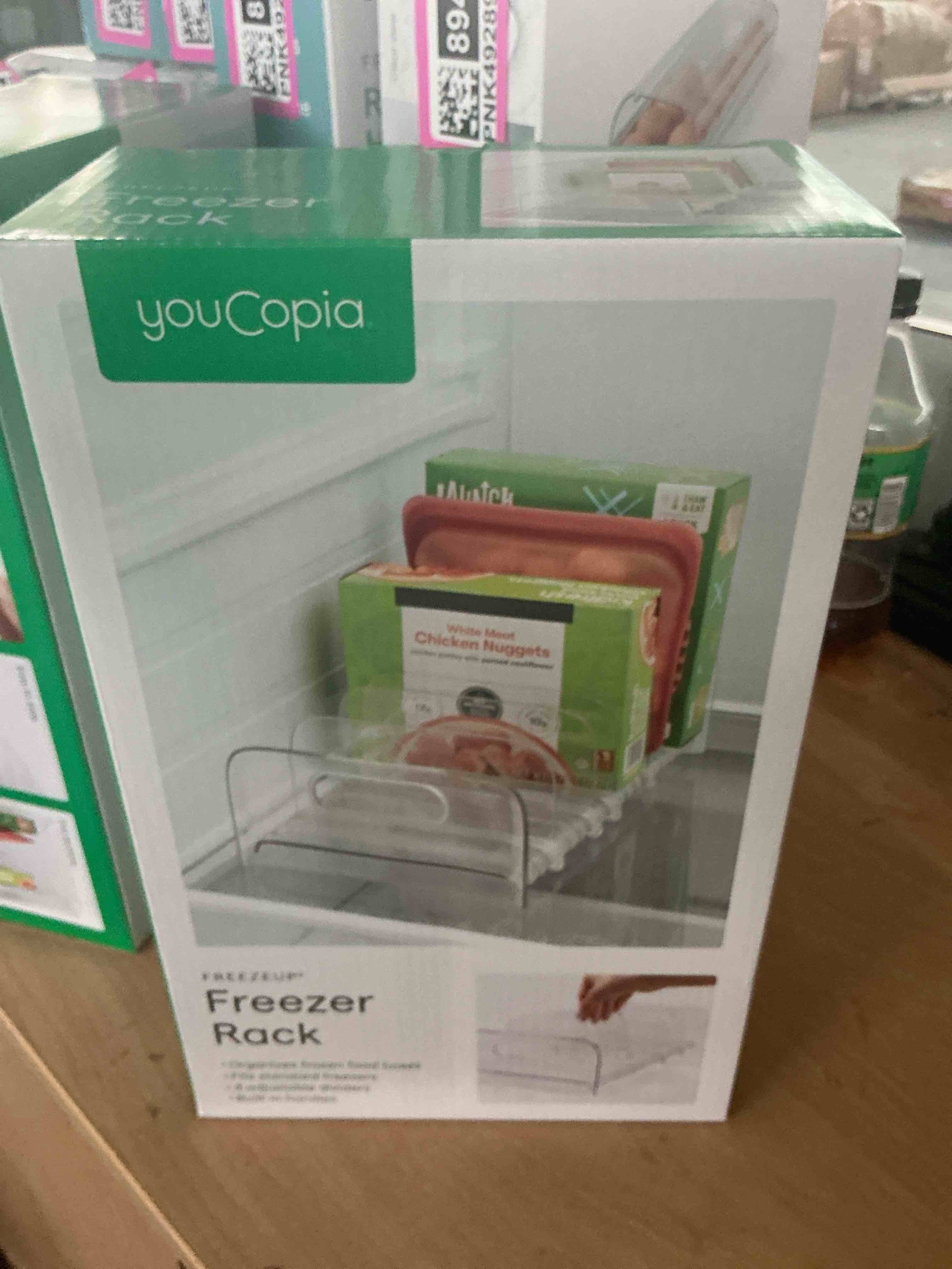 Condition photo showing New/Like New for youcopia freezeup freezer rack 12" bpa-free fridge organizer with adjustable dividers and handles for frozen food box and meal storage, clear