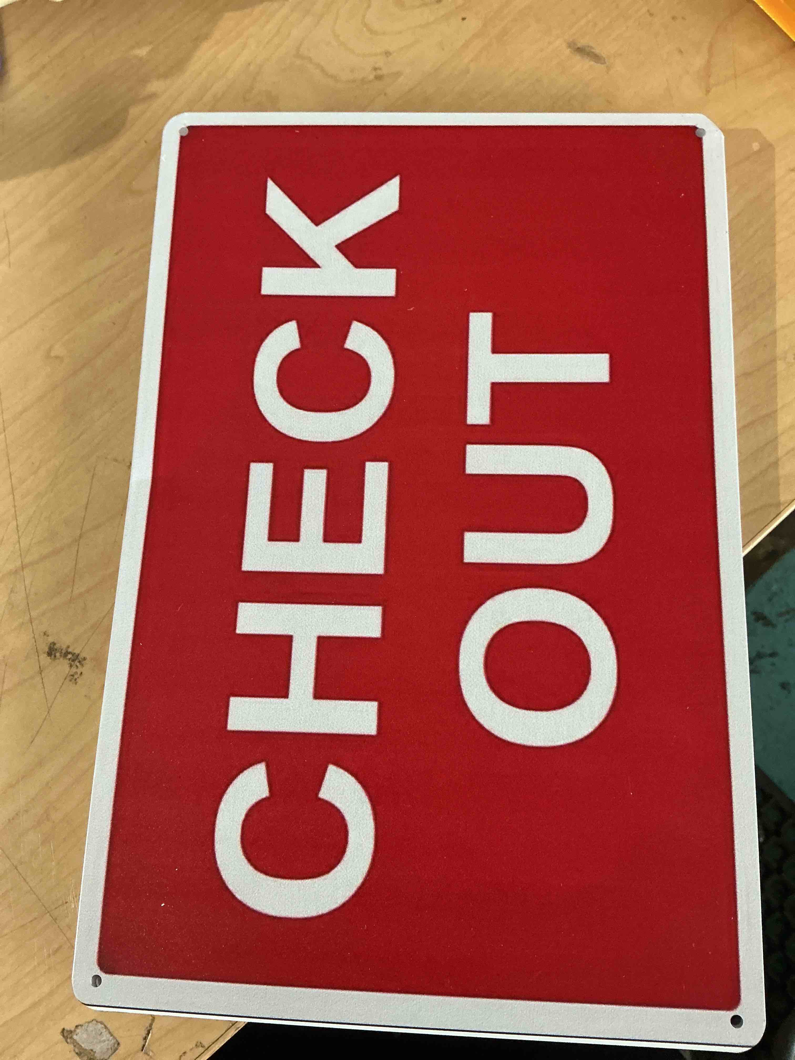 Condition photo showing New/Like New for red check out sign, 8.5 x 11 in" osha compliant information sign, weatherproof plastic, uv resistant & easy-to-read signage