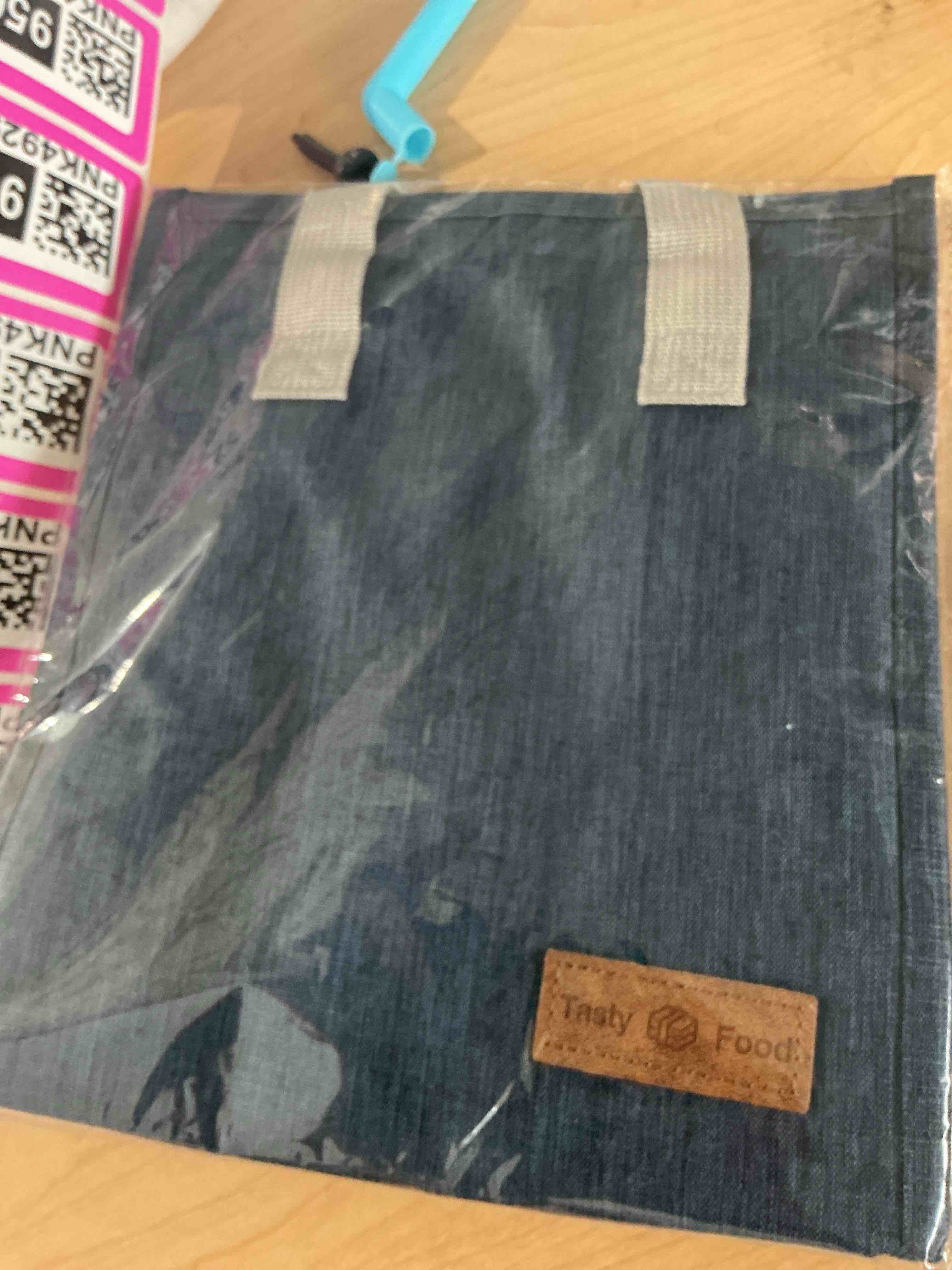 Condition photo showing New/Like New for mziart dark blue oxford cloth lunch bag, 8.86l x 5.12w x 10h, 2 gallon capacity, insulated aluminum foil interior, leakproof and lightweight