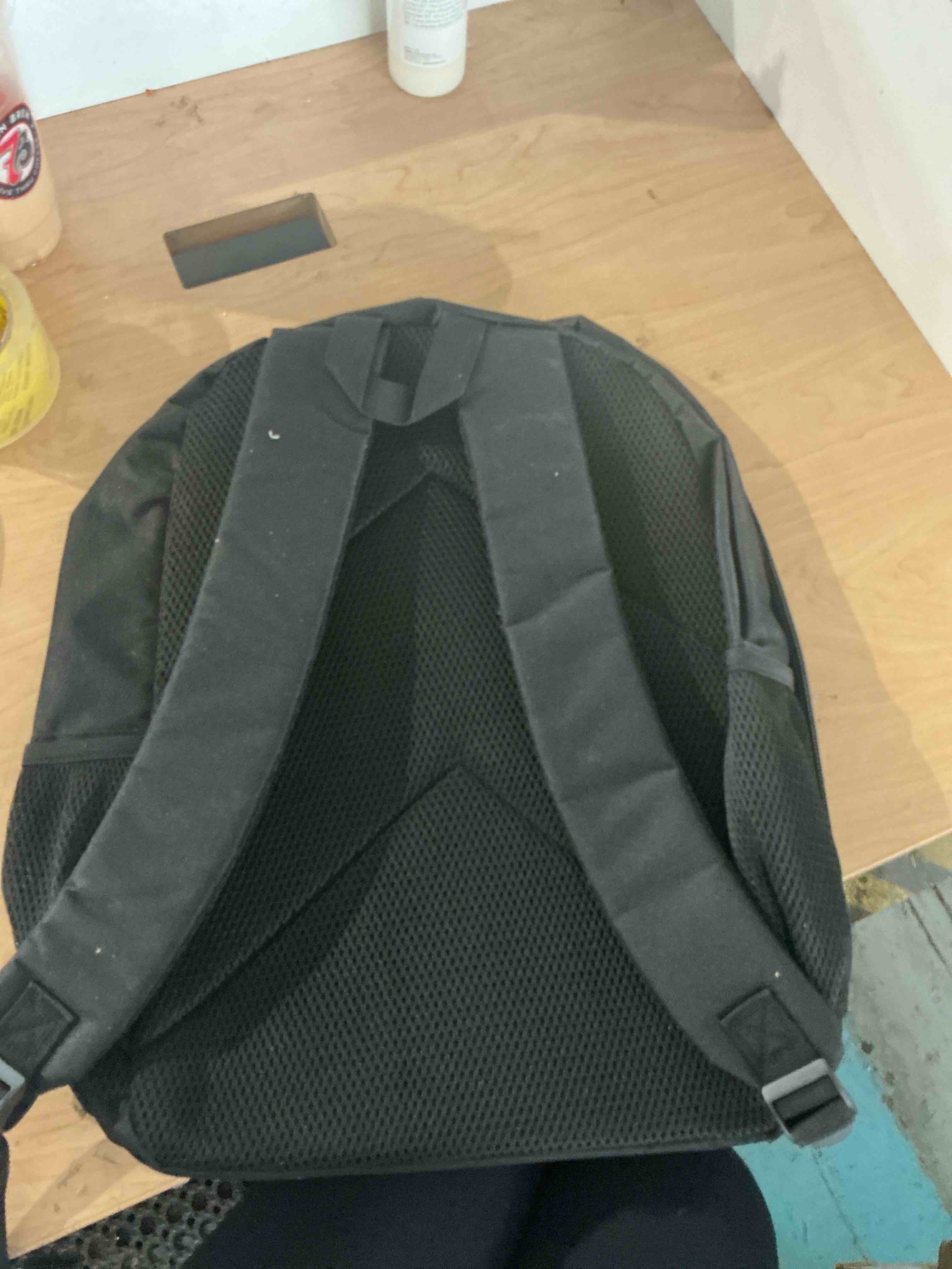 Condition photo showing New/Like New for black backpack features a graphic of the character cosmo from the game, daddy‘s world printed on the star galaxy background