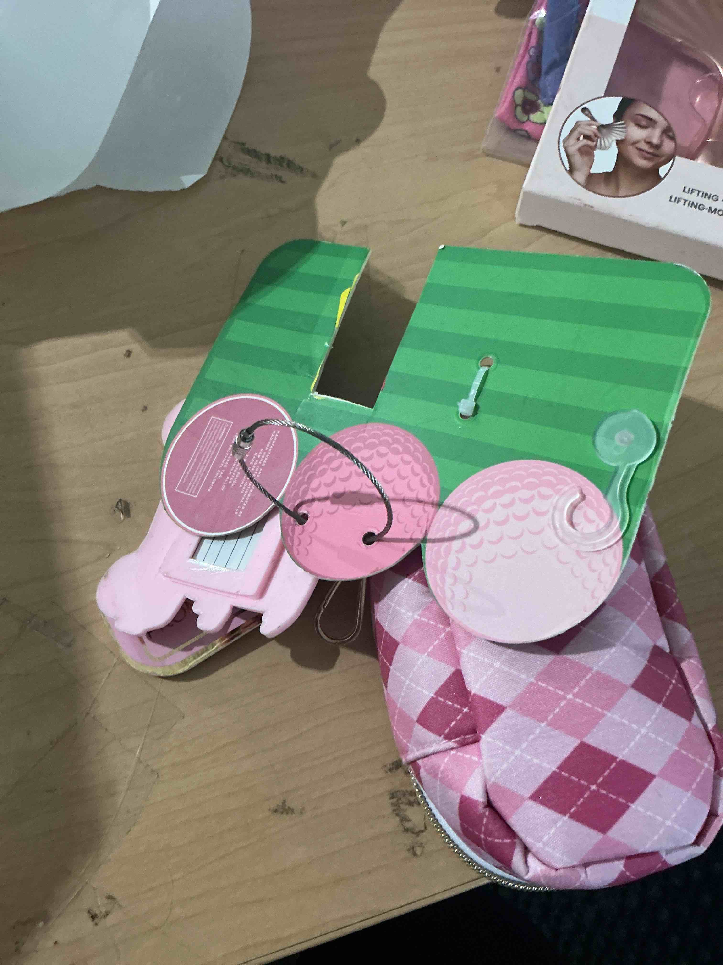 Condition photo showing New/Like New for mod and mellow mini golf pouch includes three golf balls teabag tag set pink