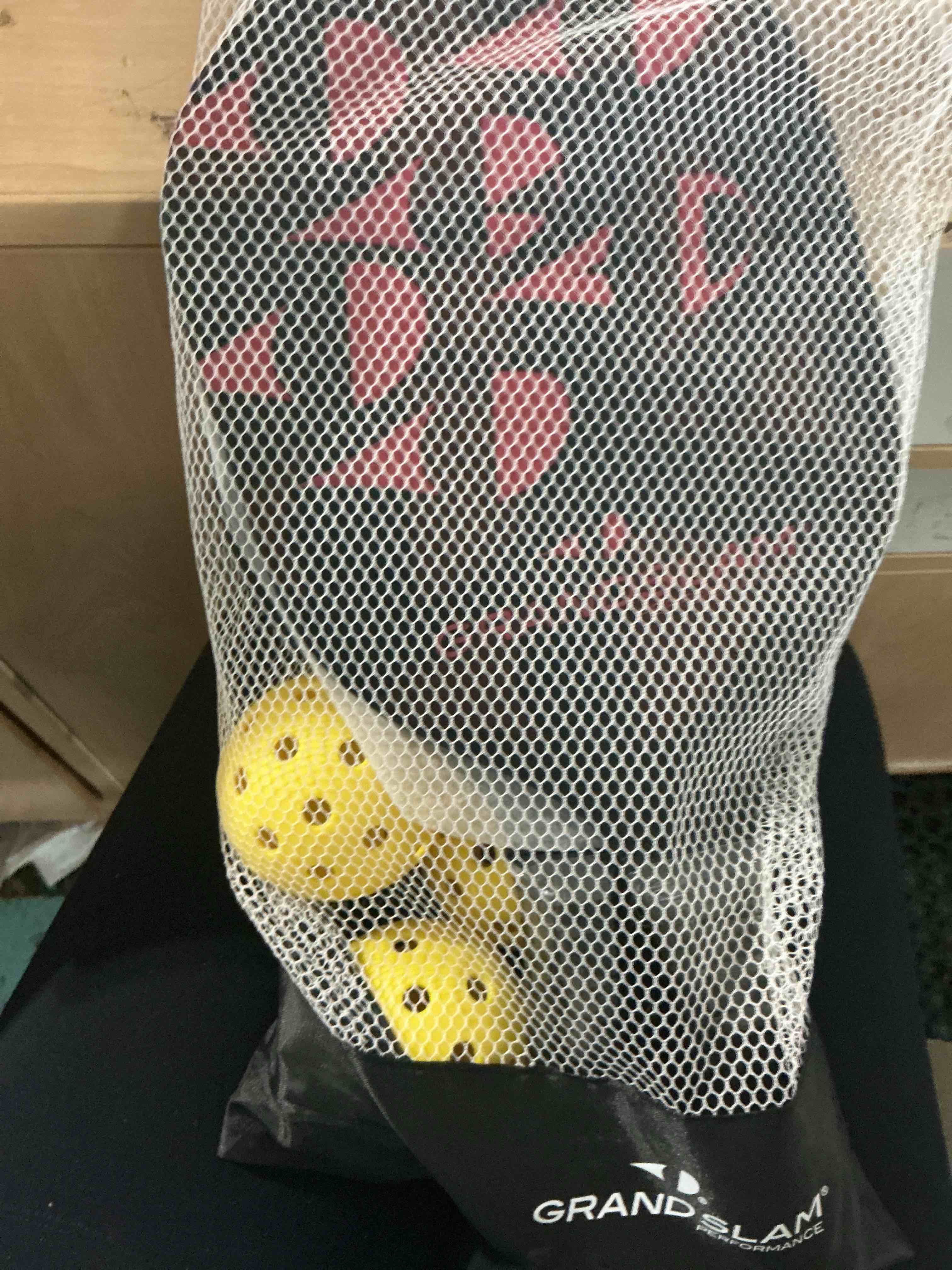 Condition photo showing New/Like New for grandslam performance pickleball four balls and two paddles