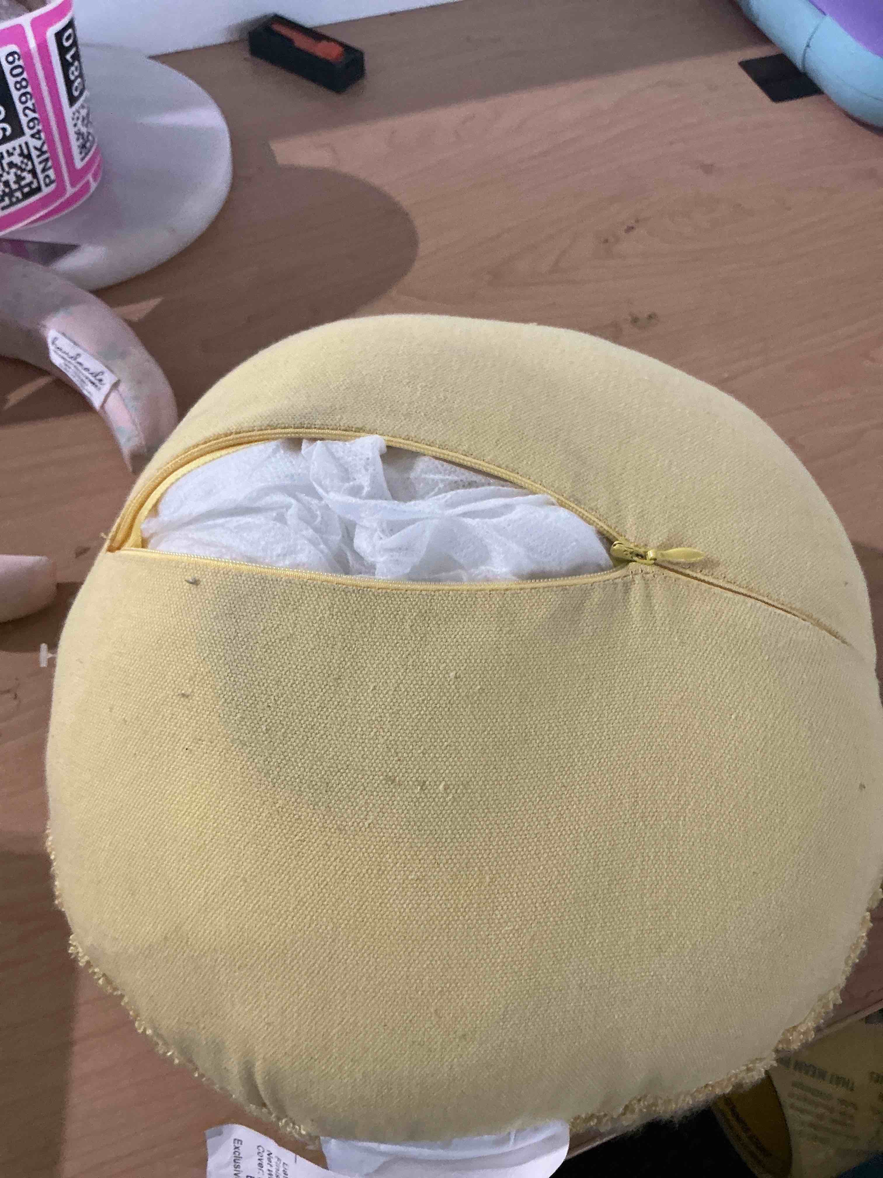 Condition photo showing As Is for smiley sherpa round pillow