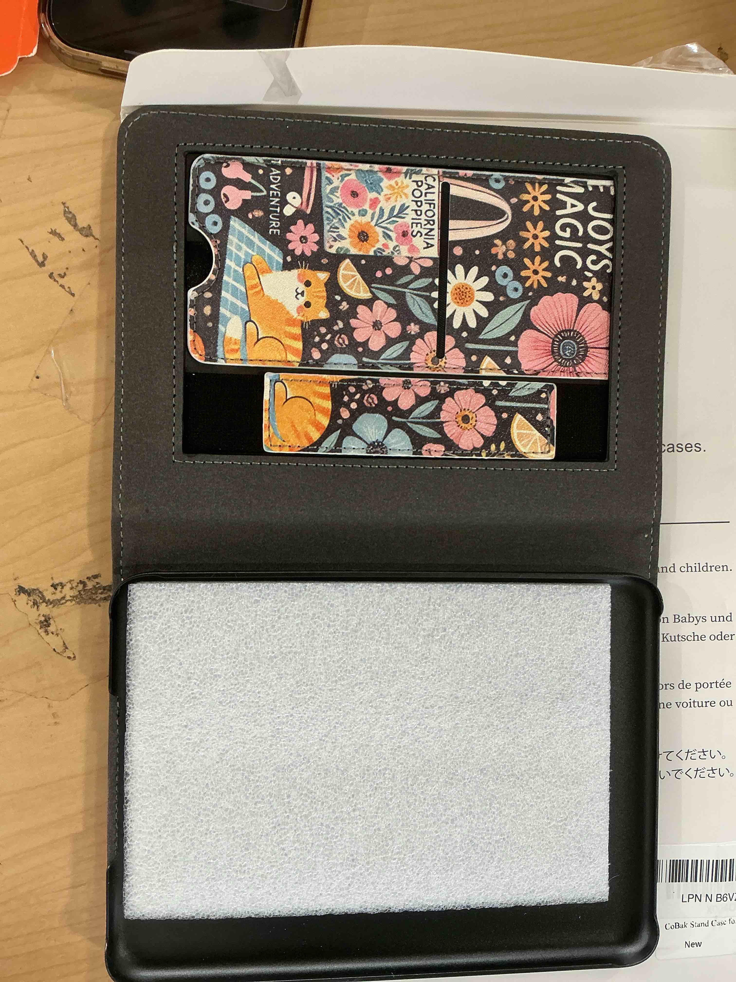 Condition photo showing Good Condition for cobak stand case for 7" kindle paperwhite 12th gen 2024 and kindle colorsoft with hand strap - compatible with iphone magsafe, for samsung/belkin/anker wireless charging pads, durable, auto sleep-gray 7" kindle paperwhite 12th little joys