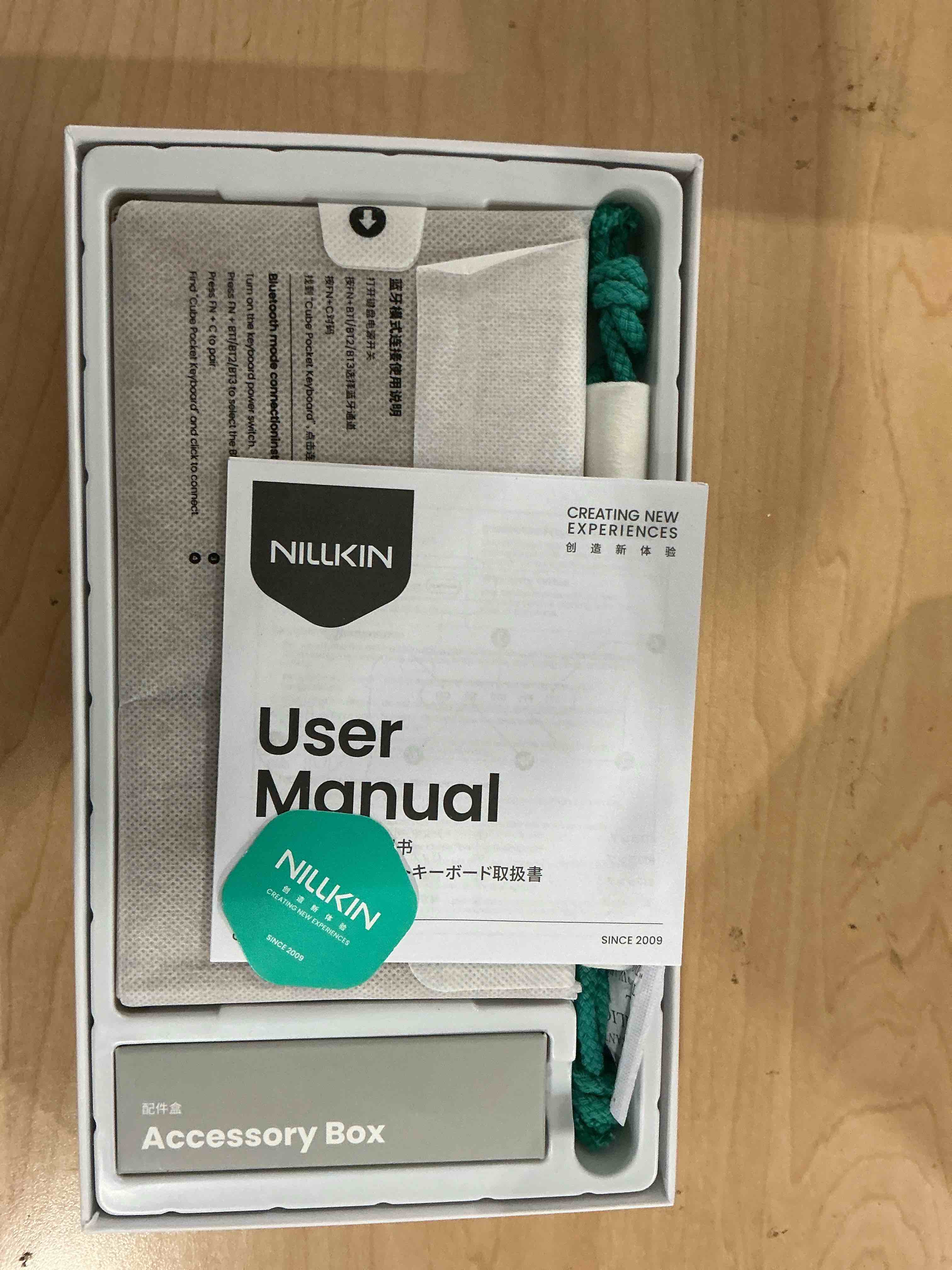 Condition photo showing New/Like New for Nillkin Upgraded Foldable Bluetooth Keyboard with Touchpad & Number Pad, Portable Wireless Keyboard for Travel, Pocket-Sized, Full Size Keys, Support 3 Devices for iPad Laptop Tablets Phone, Khaki