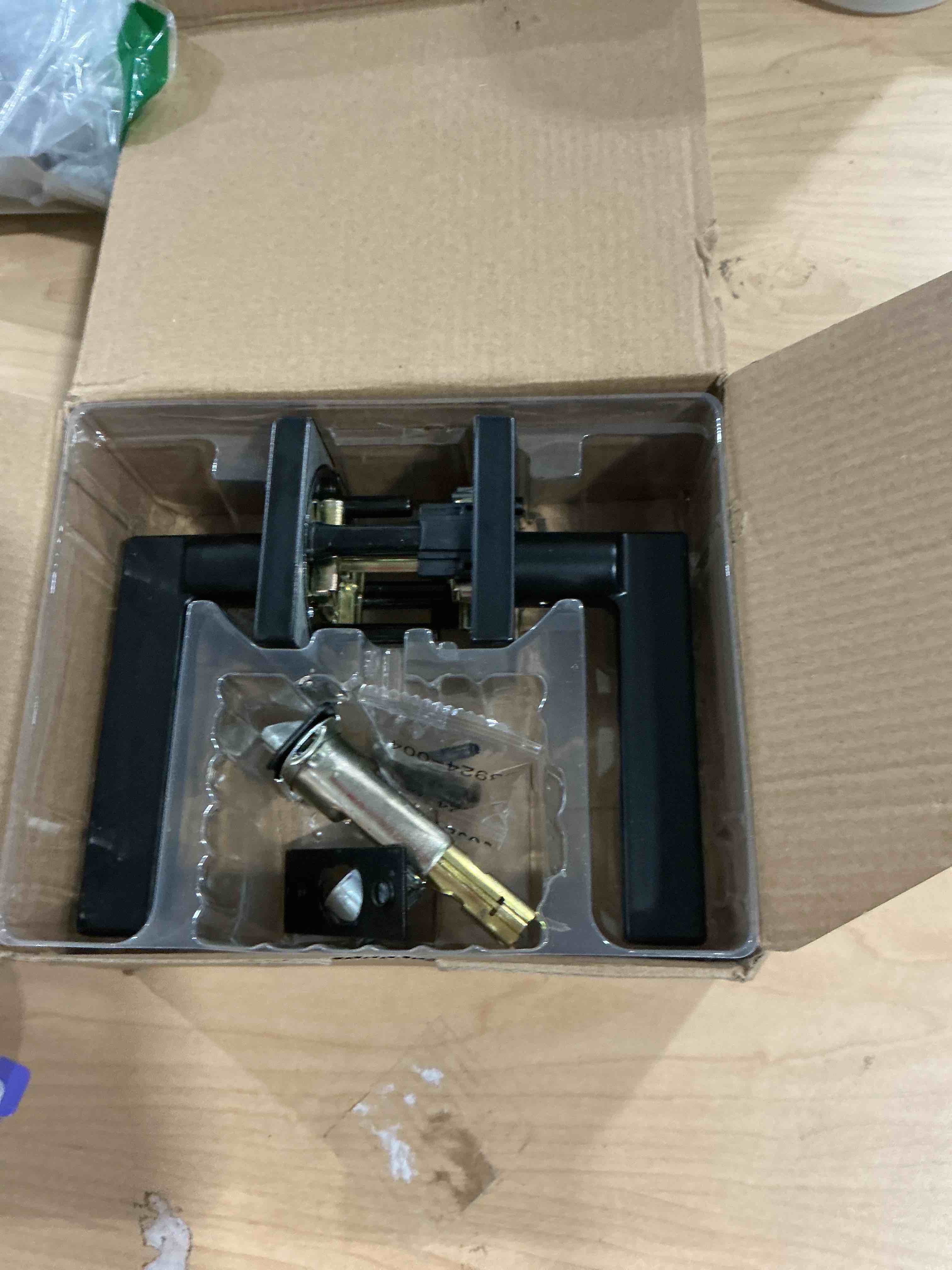 Condition photo showing Good Condition for Kwikset Halifax Interior Privacy Door Handle with Lock, Door Lever For Bathroom and Bedroom, Matte Black Reversible Keyless Push Button Lock Door Lever, with Microban Protection, Square Rose Matte Black 1 Pack Privacy