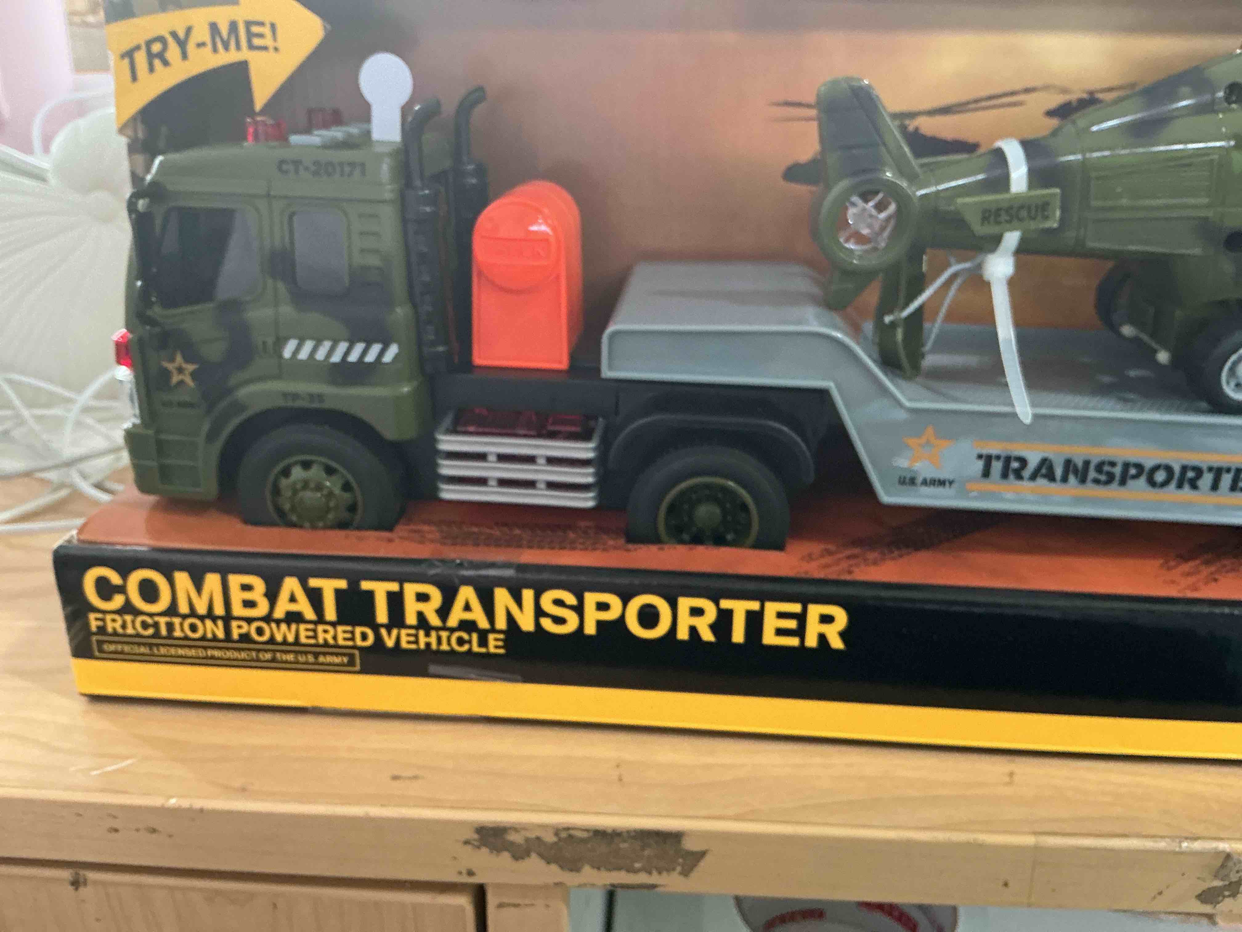 Condition photo showing New/Like New for combat transporter friction powered vehicle for kids toys