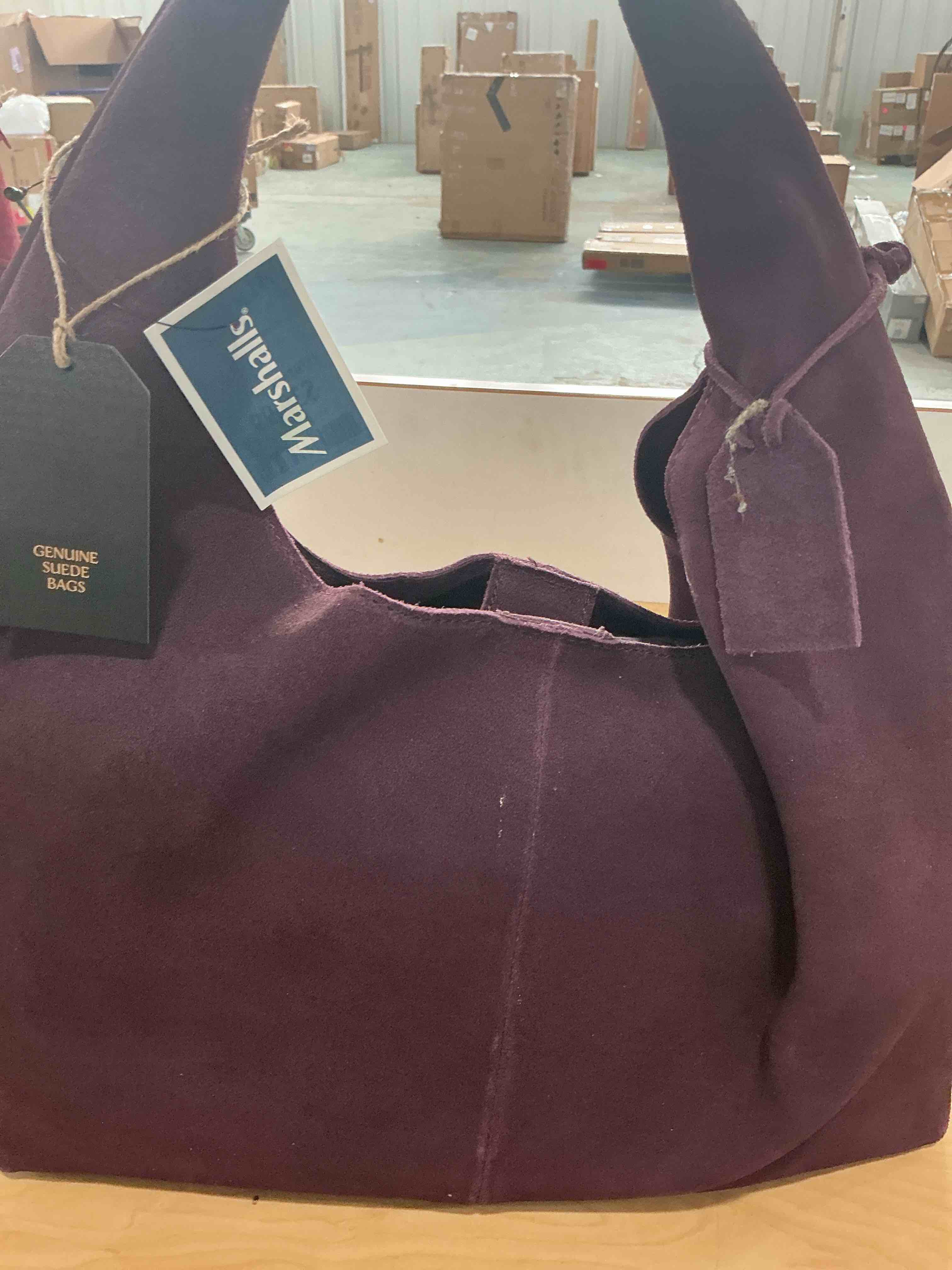 Condition photo showing New/Like New for purple bag, genuine, suede leather