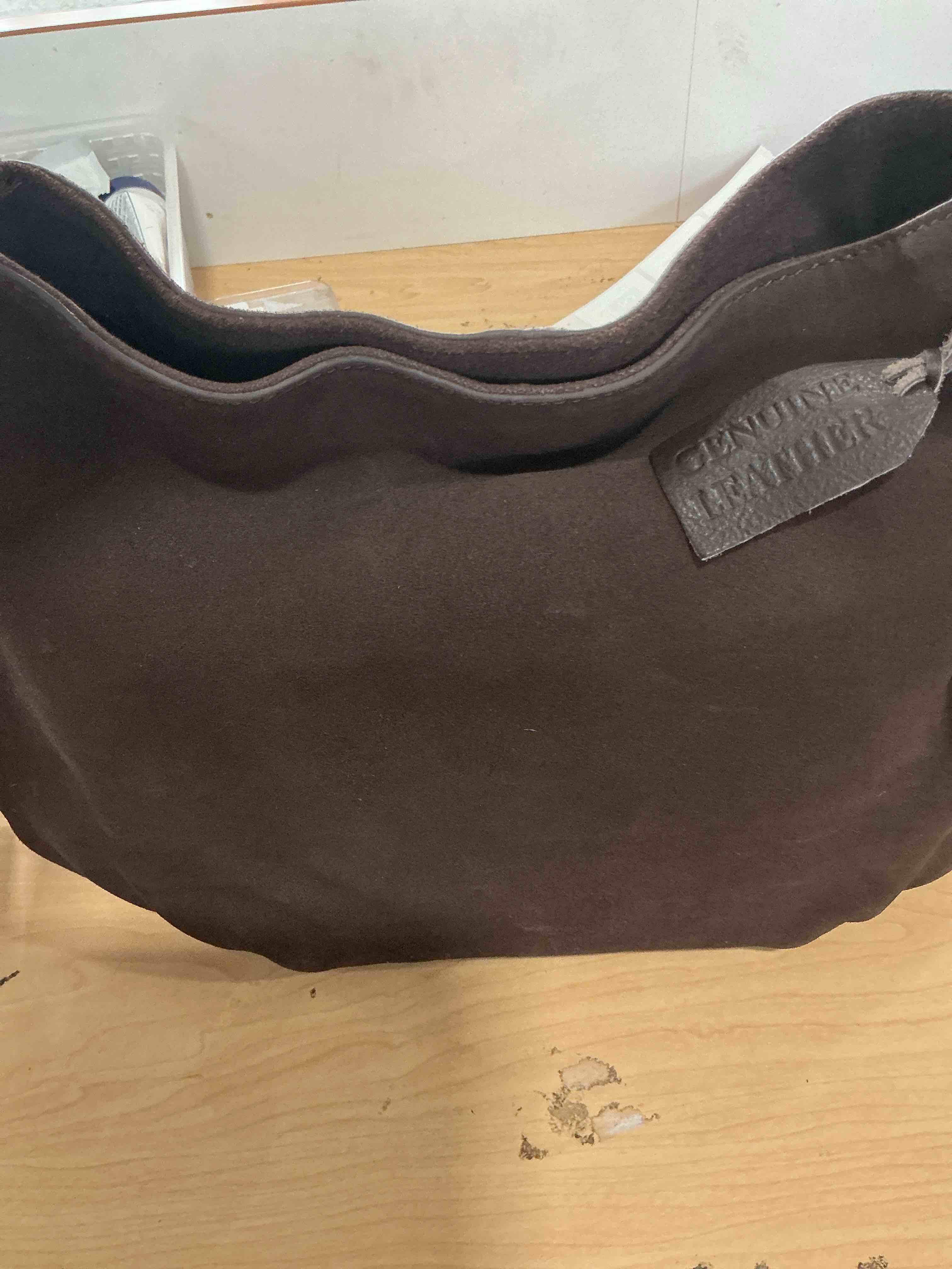 Condition photo showing New/Like New for brown leather bag with gold accents