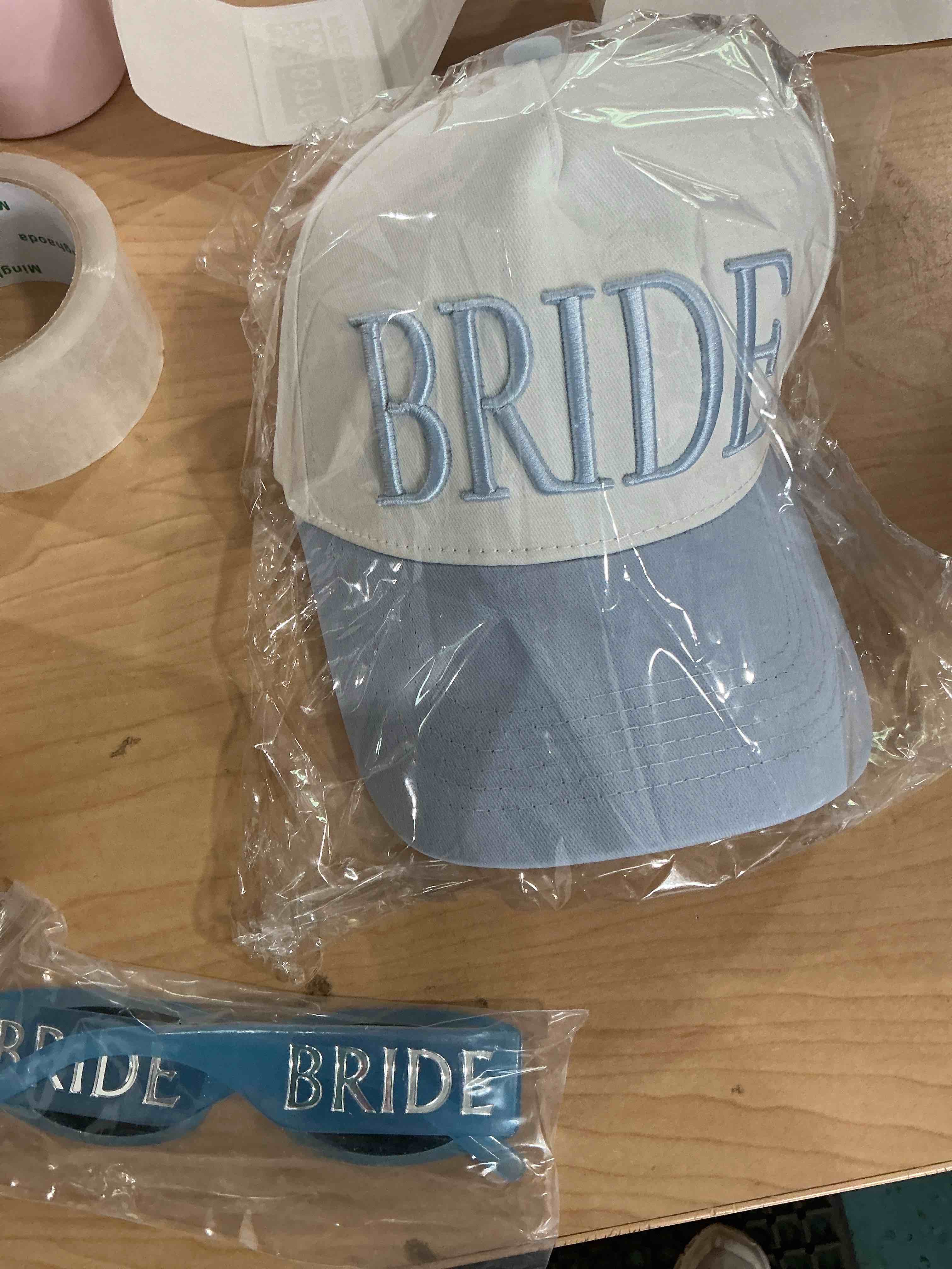 Condition photo showing New/Like New for 2 pcs blue white bride trucker hat baseball cap, marble sunglasses, (no earring) something blue accessories for bridal bachelorette bach party decorations wedding day