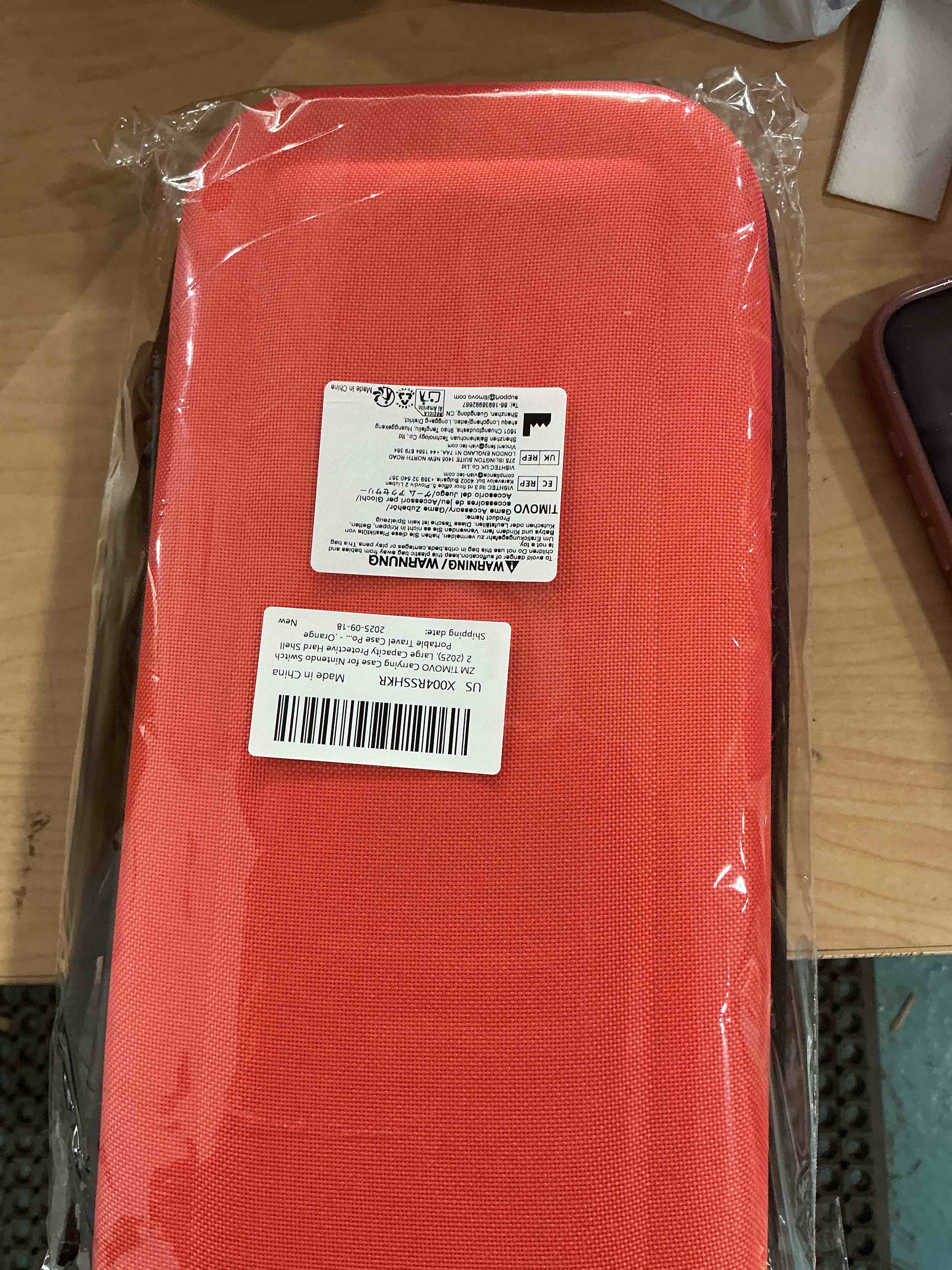Condition photo showing New/Like New for timovo carrying case for nintendo switch 2 (2025), large capacity protective hard shell portable travel case pouch for switch 2, with 10 game card slots and pockets for console & accessories, orange orange 10 slots