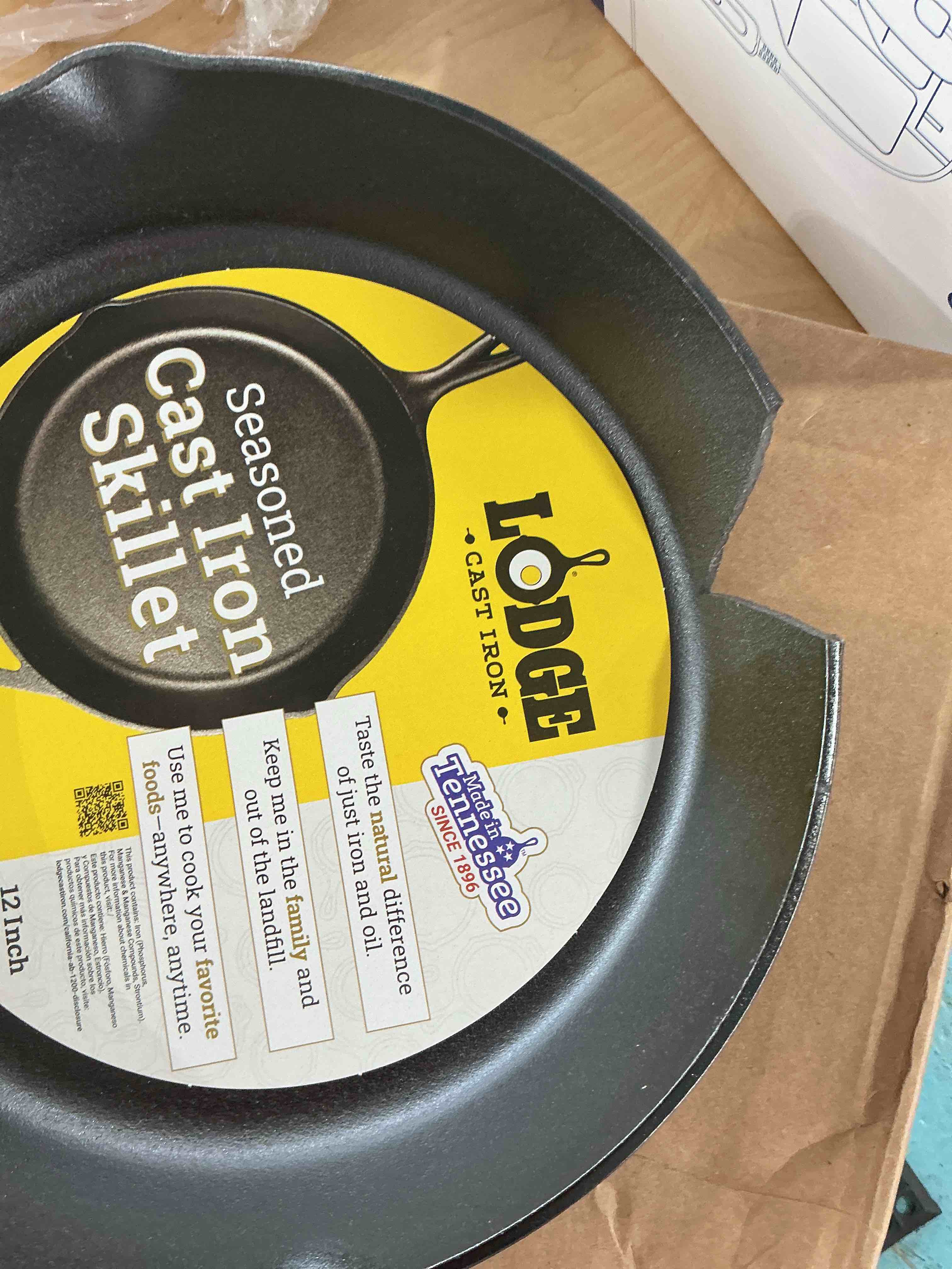 Condition photo showing As Is for broken Lodge 12 Inch Cast Iron Pre-Seasoned Skillet – Signature Teardrop Handle - Use in the Oven, on the Stove, on the Grill, or Over a Campfire - Black 12 Inch (1 Count)