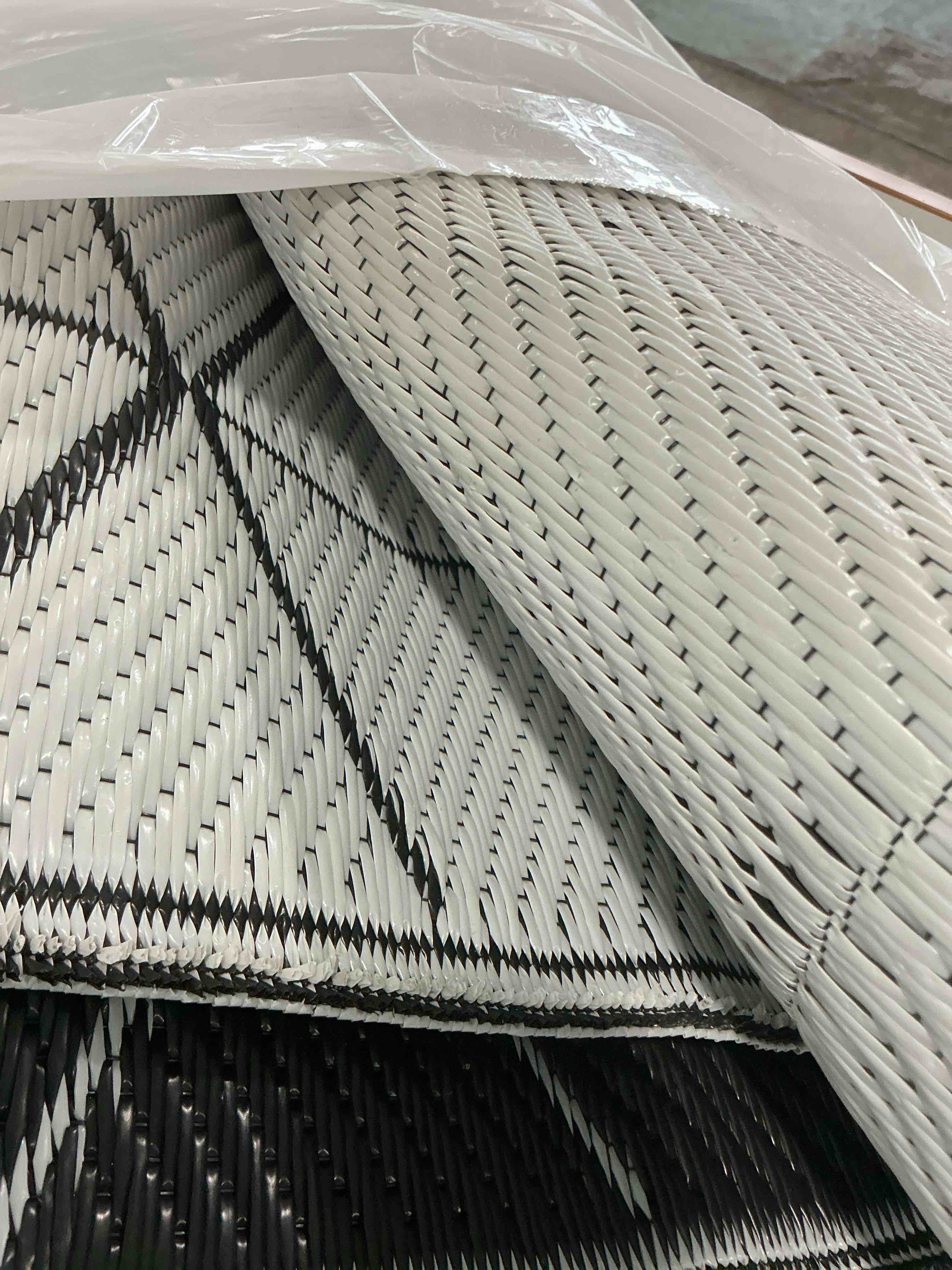 Condition photo showing Good Condition for GENIM *look at photos for accurate design *Outdoor Rug Waterproof for Patio Decor, Foldable Reversible Plastic Straw Area Rugs Mat for Camper, Outside Carpet for Rv, Deck, Porch, Picnic, Beach, Balcony, Black & White