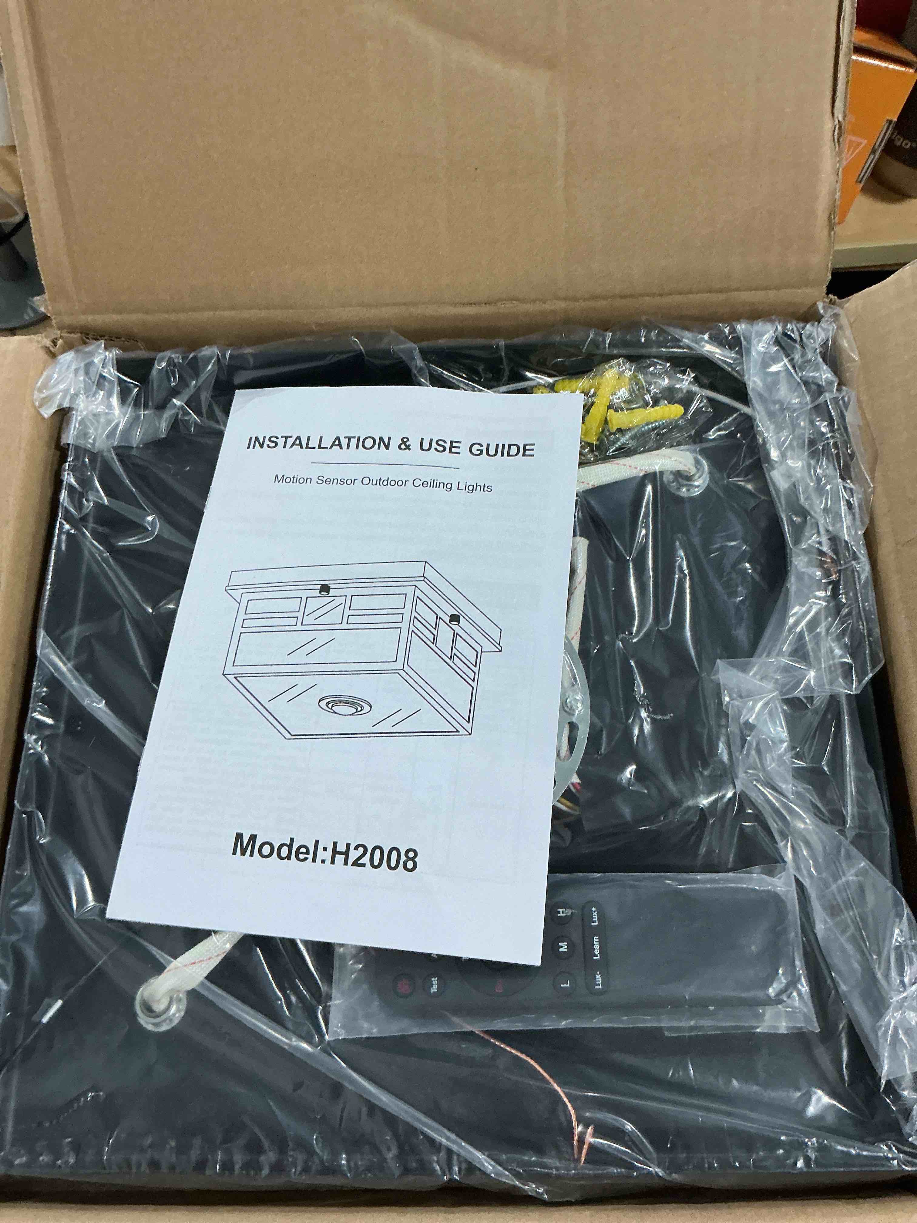 Condition photo showing New/Like New for Upgraded Motion Sensor Outdoor Ceiling Light with Remote Control, Adjustable 4 Modes Sensor Dusk to Dawn 2-Light Exterior Light Fixture with Water Ripple Glass and for Porch,Patio,Garage BlackH2008