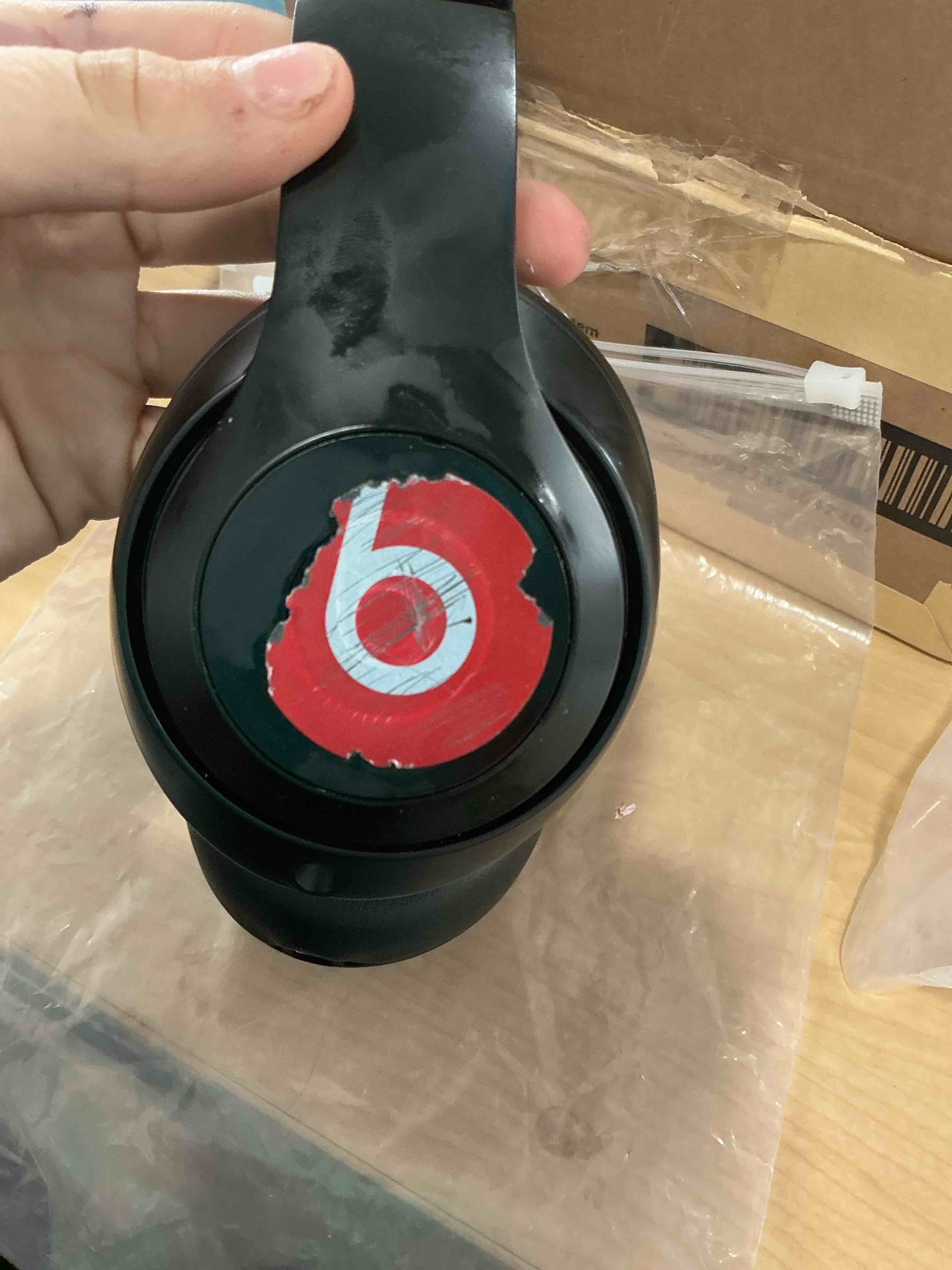 Condition photo showing As Is for has a sticker that won’t come off Beats Studio Pro - Premium Wireless Over-Ear Headphones- Up to 40-Hour Battery Life, Active Noise Cancelling, USB-C Lossless Audio, Apple & Android Compatible - Black Black Beats Studio Pro