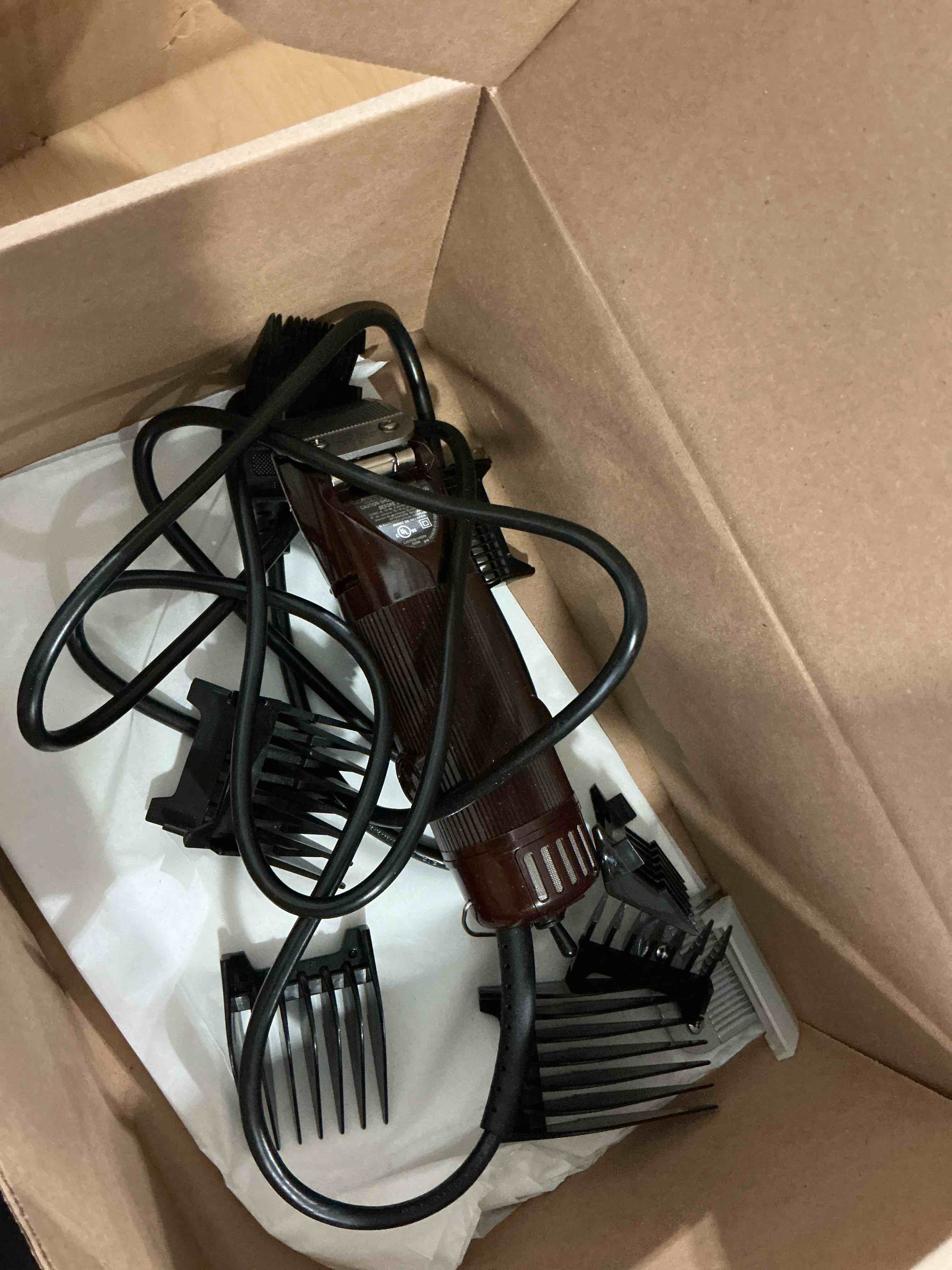 Condition photo showing As Is for OSTER Classic 76 Hair Clipper Bundle - 2 items, includes pack of 8 plastic comb blades