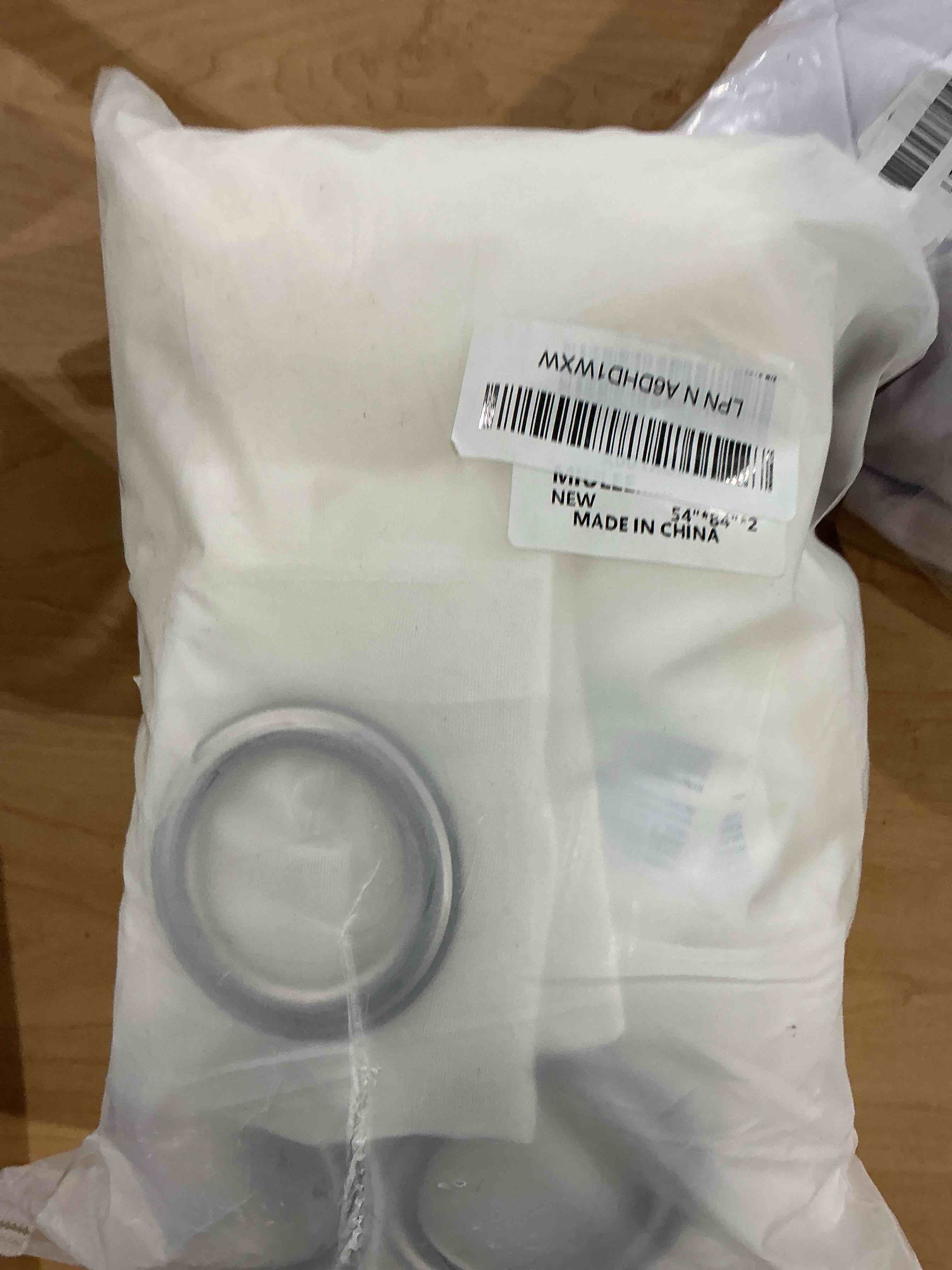 Condition photo showing New/Like New for MIULEE 2 Panels Solid Color Ivory Sheer Curtains Elegant Grommet Top Window Voile Panels/Drapes/Treatment for Bedroom Living Room (54X84 Inches) Ivory 54"W x 84"L (Pack of 2)