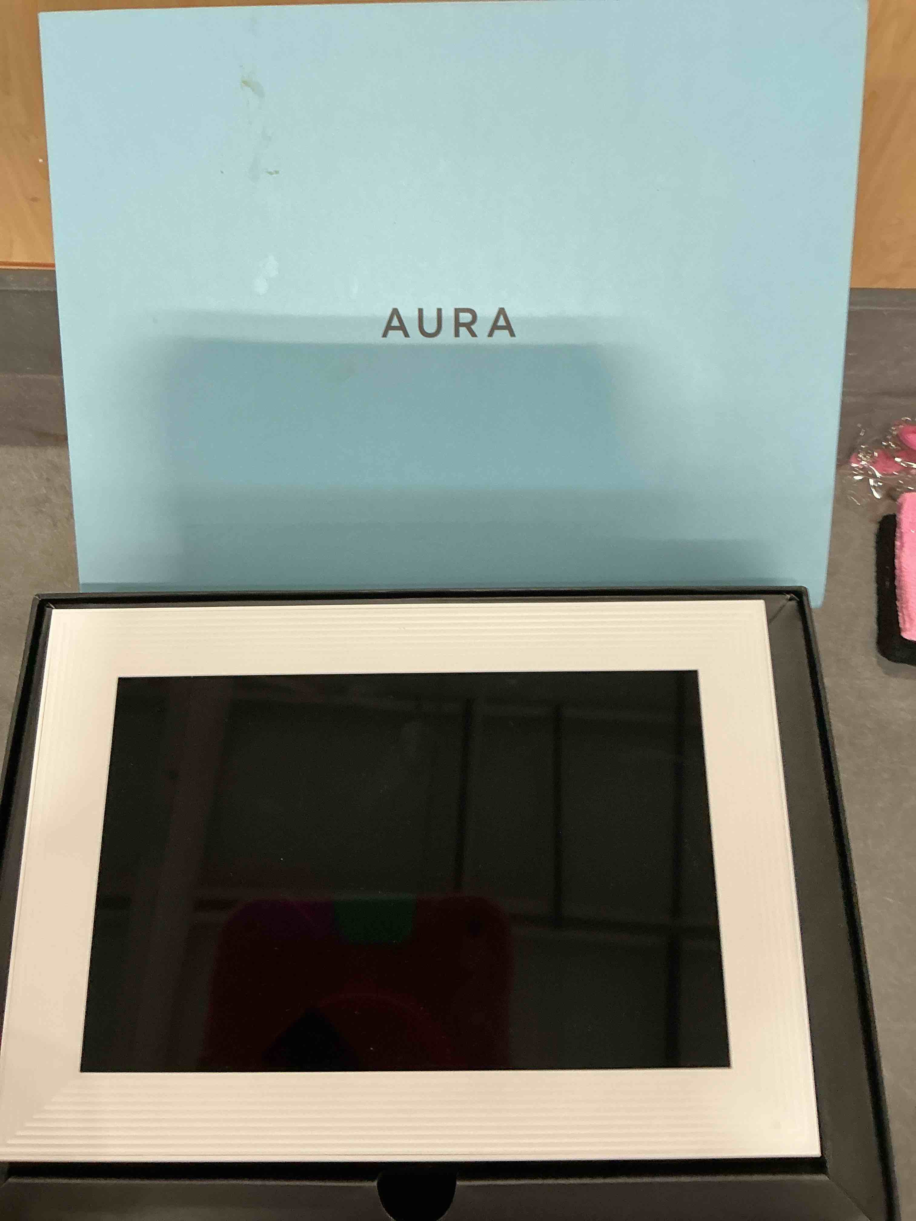 Condition photo showing New/Like New for Aura Digital Picture Frame - 10.1" HD Display | Wirecutter's Best Digital Frame | Text Photos Directly to Your Frame from Anywhere | Quick & Easy Setup Over WiFi - Free Aura App | No ads or fees