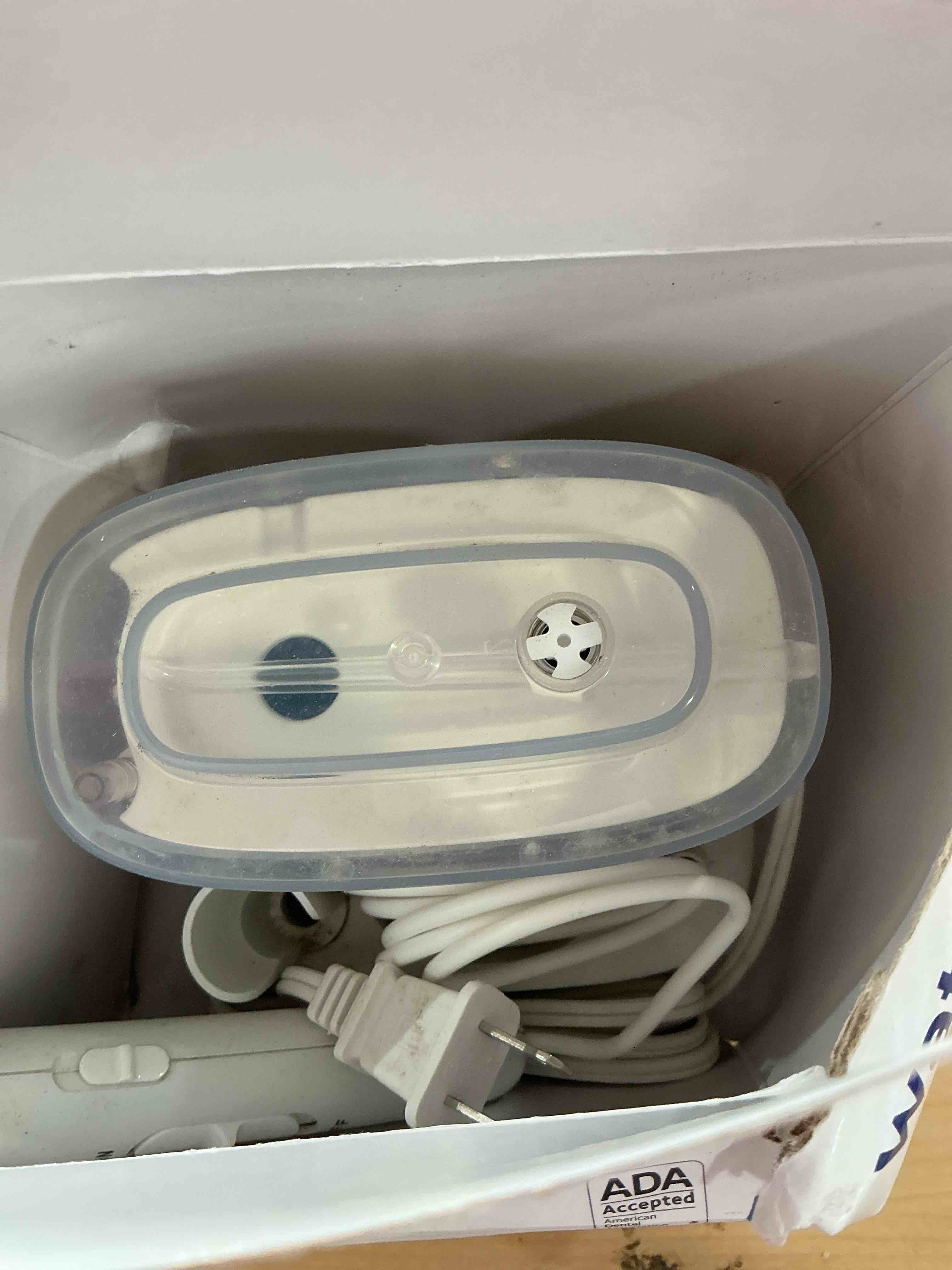 Condition photo showing Good Condition for Waterpik Nano Plus Water Flosser For Teeth, Portable Electric Power, Compact For Travel and Home, 4 Flossing Tips, ADA Accepted, White WP-320