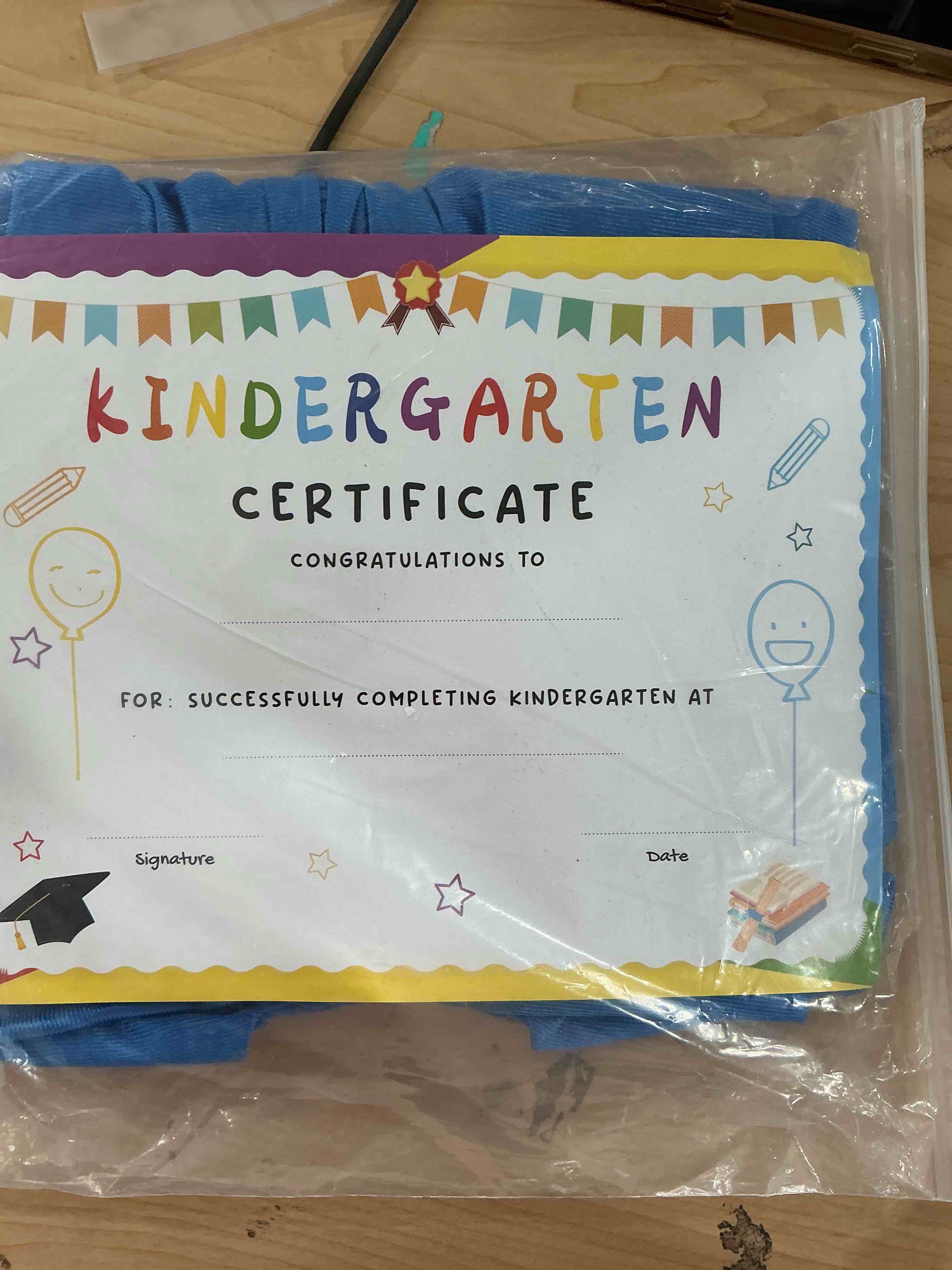 Condition photo showing New/Like New for Kindergarten graduation cap and gown with 2025 Tassel, Certificatefor Toddler Children (27"-33") Blue Small/27 inches