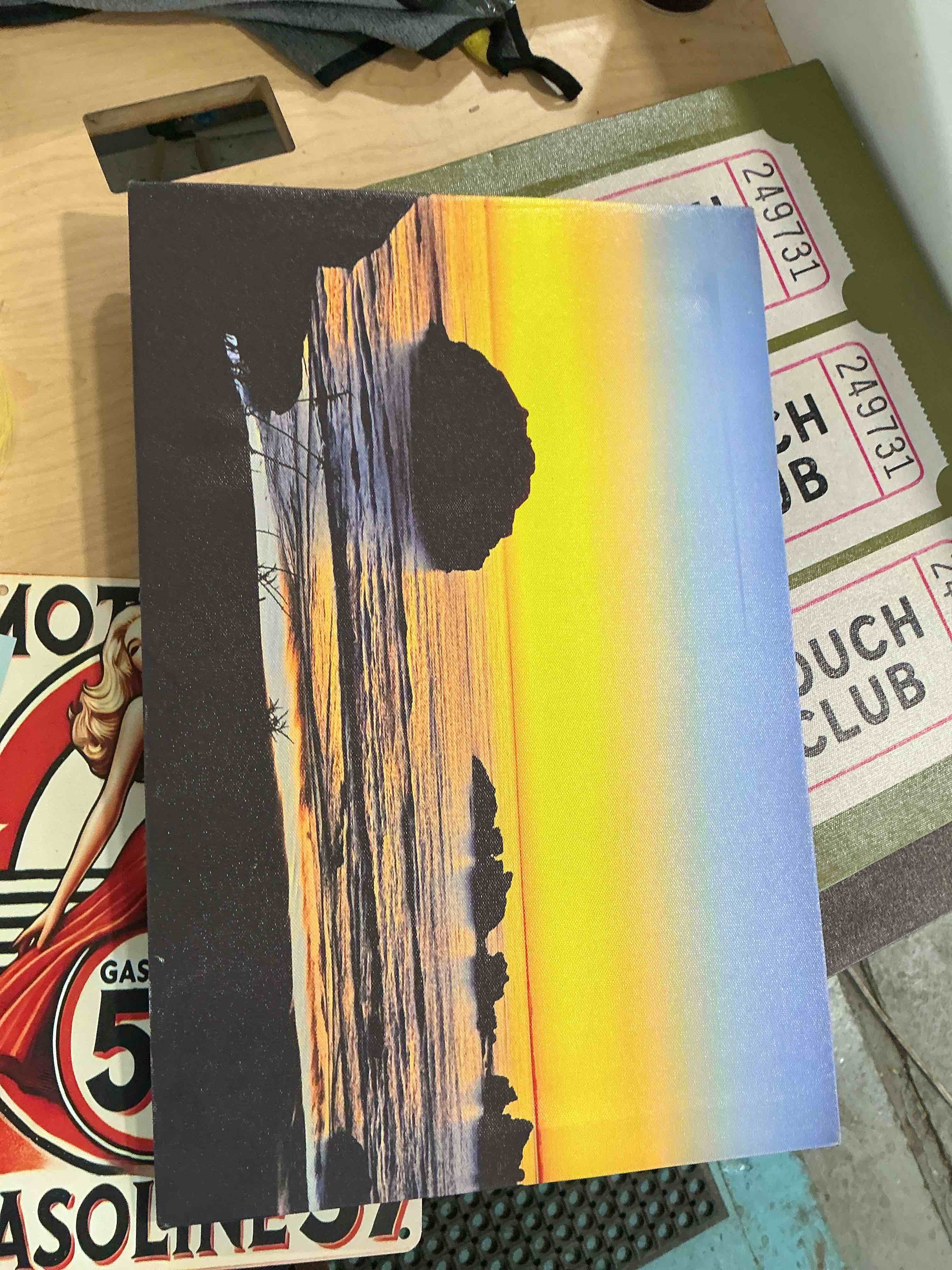 Condition photo showing New/Like New for coastal sunset art print on canvas featuring vibrant, yellow sky, and silhouetted shorelines 