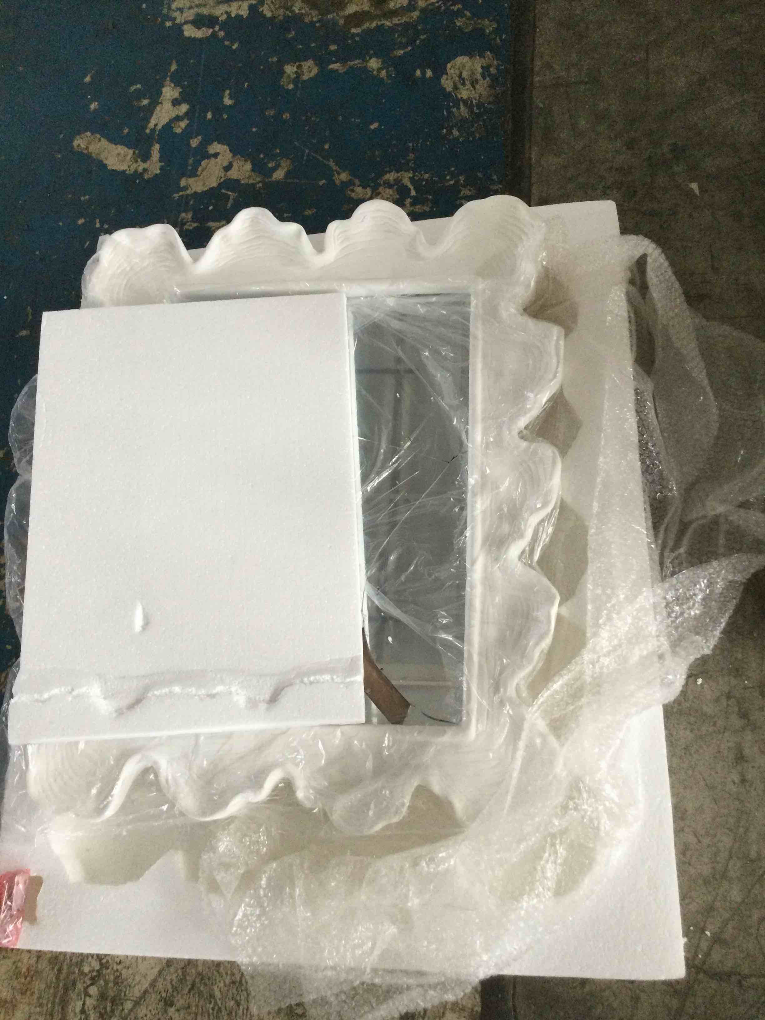Condition photo showing As Is for uttermost sea coral matte white 27 1/4" x 34 1/4" vanity wall mirror