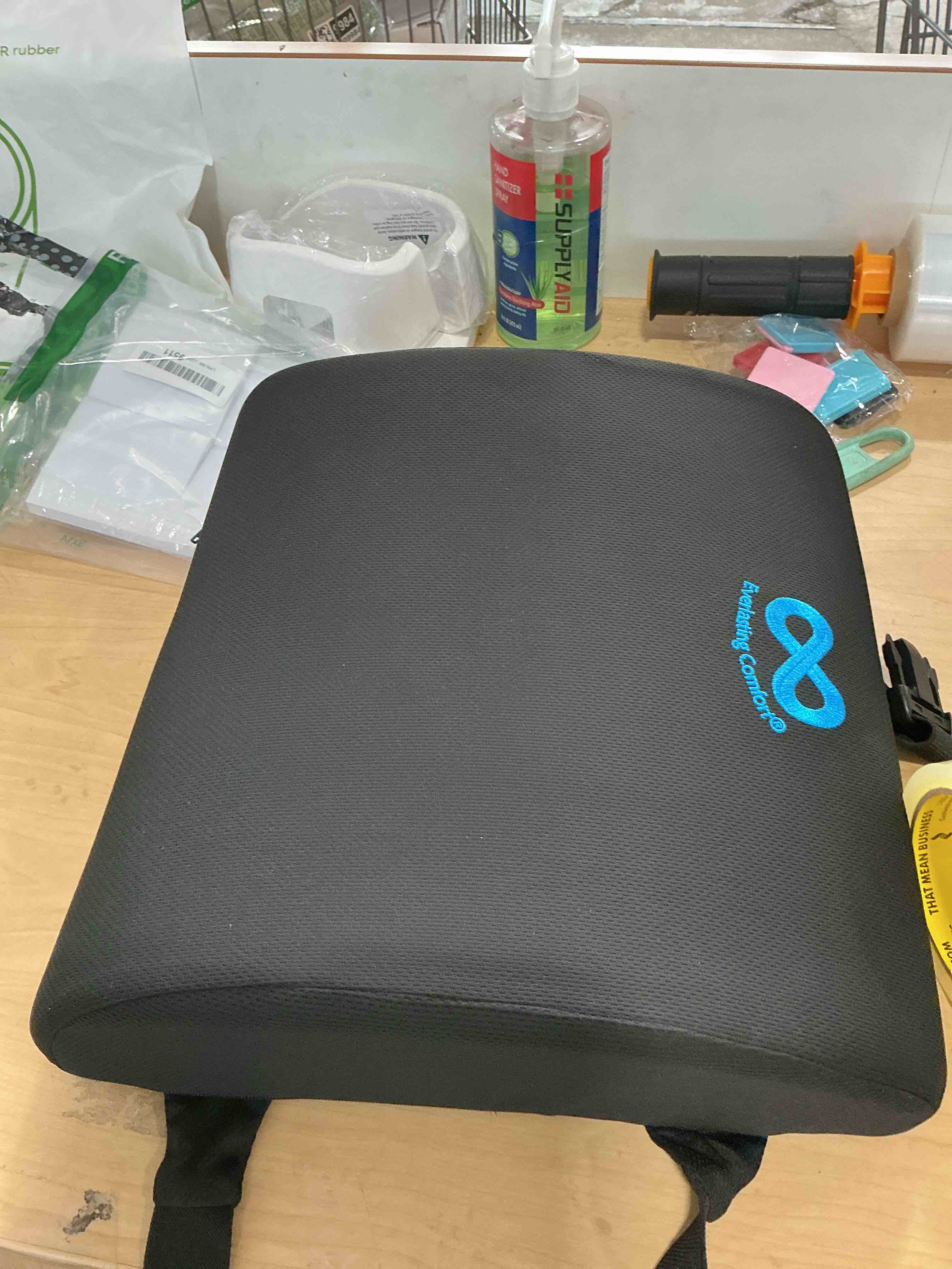 Condition photo showing New/Like New for everlasting comfort the original lumbar support pillow for office chair - improves posture, promotes back pain relief - superior back support for gaming and desk chairs - lumbar pillow for car, couch a. black mesh