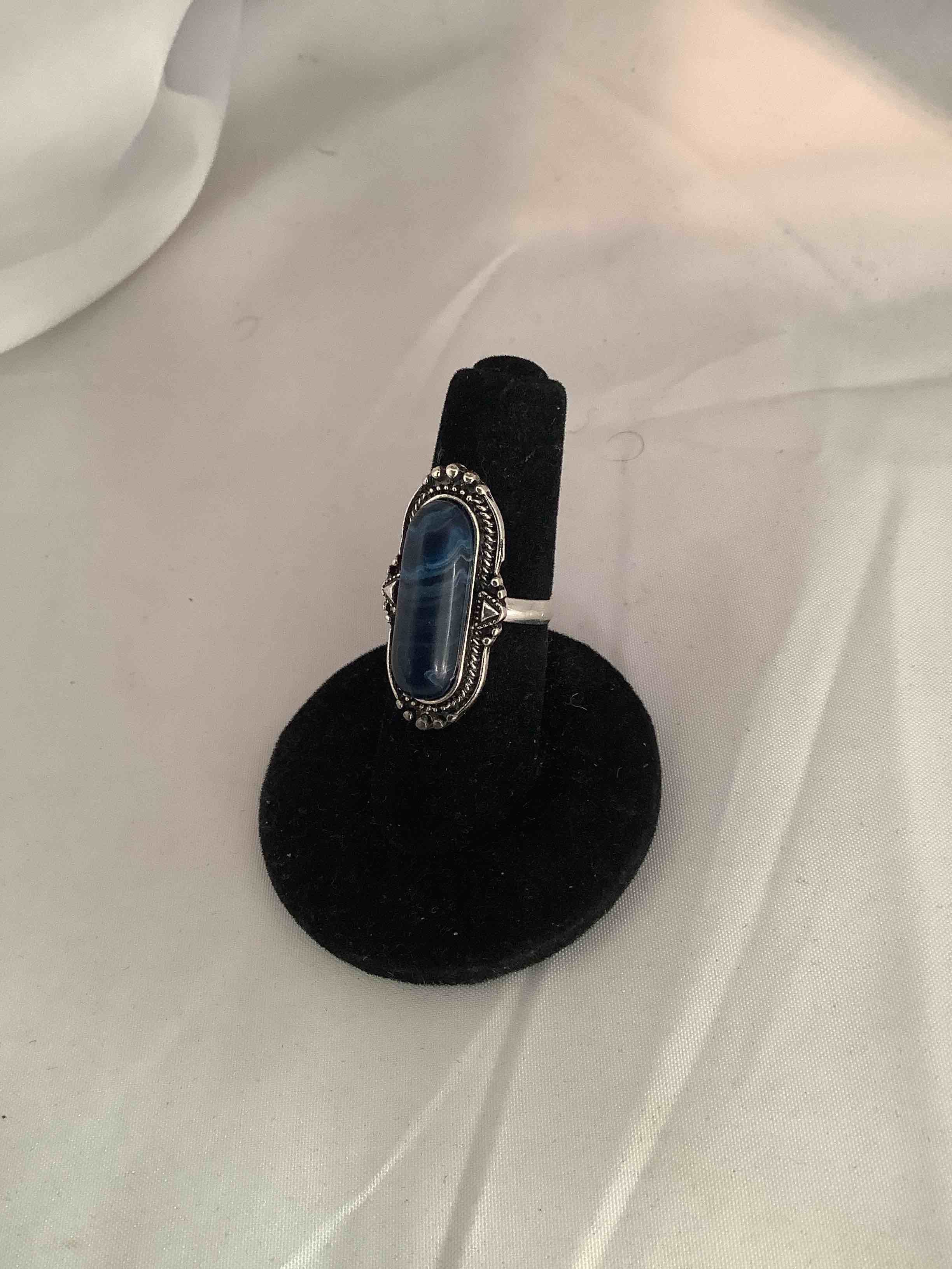 Condition photo showing New/Like New for designer ring