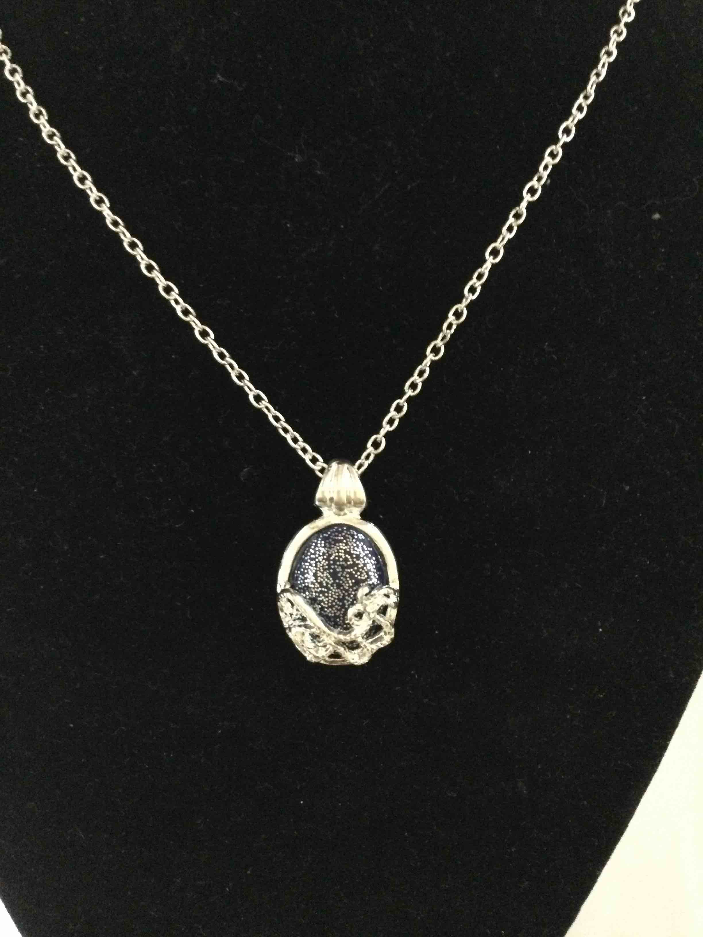 Condition photo showing New/Like New for designer necklace