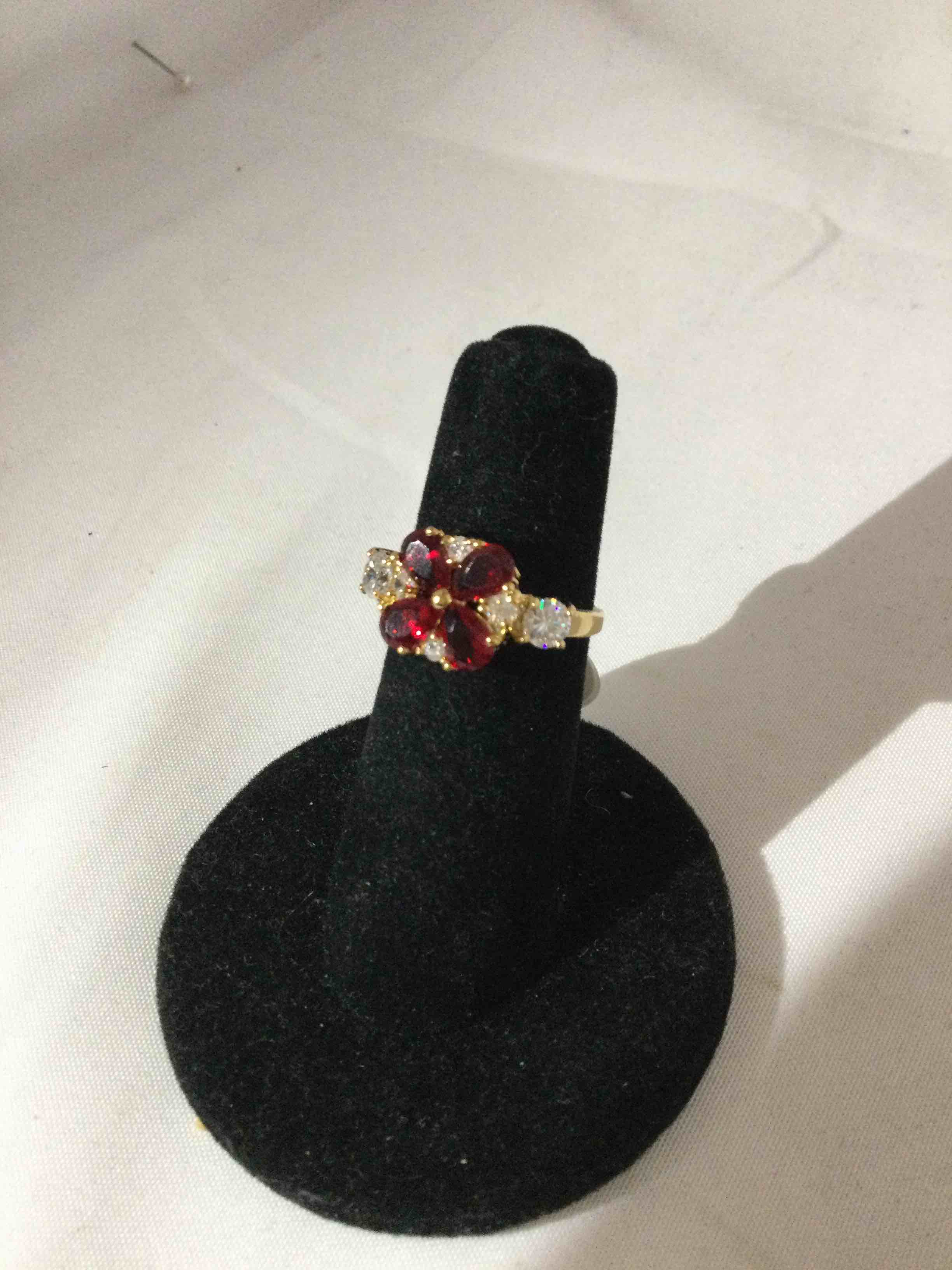 Condition photo showing New/Like New for ruby and white sapphire ring
