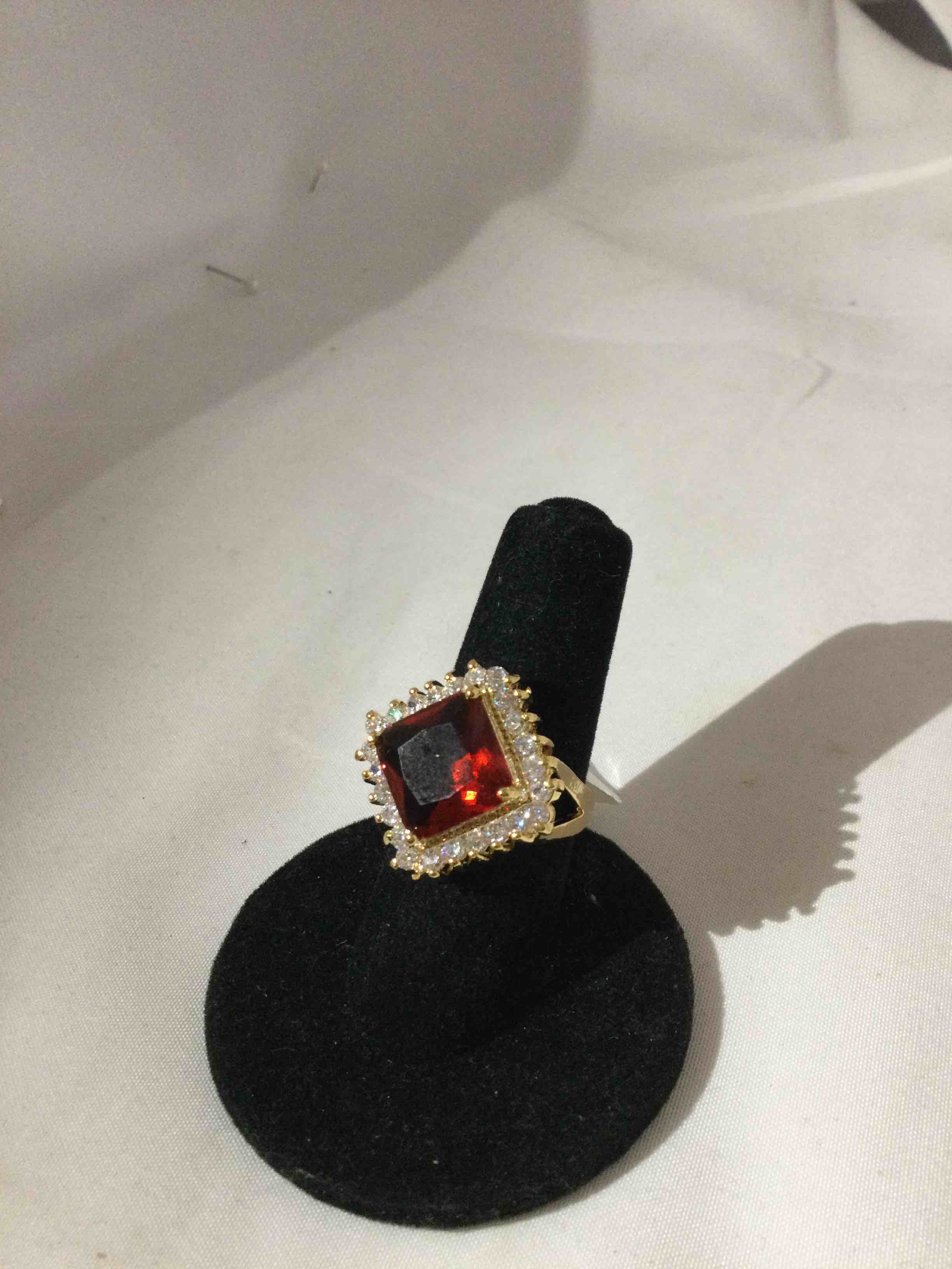 Condition photo showing New/Like New for ruby and white sapphire ring