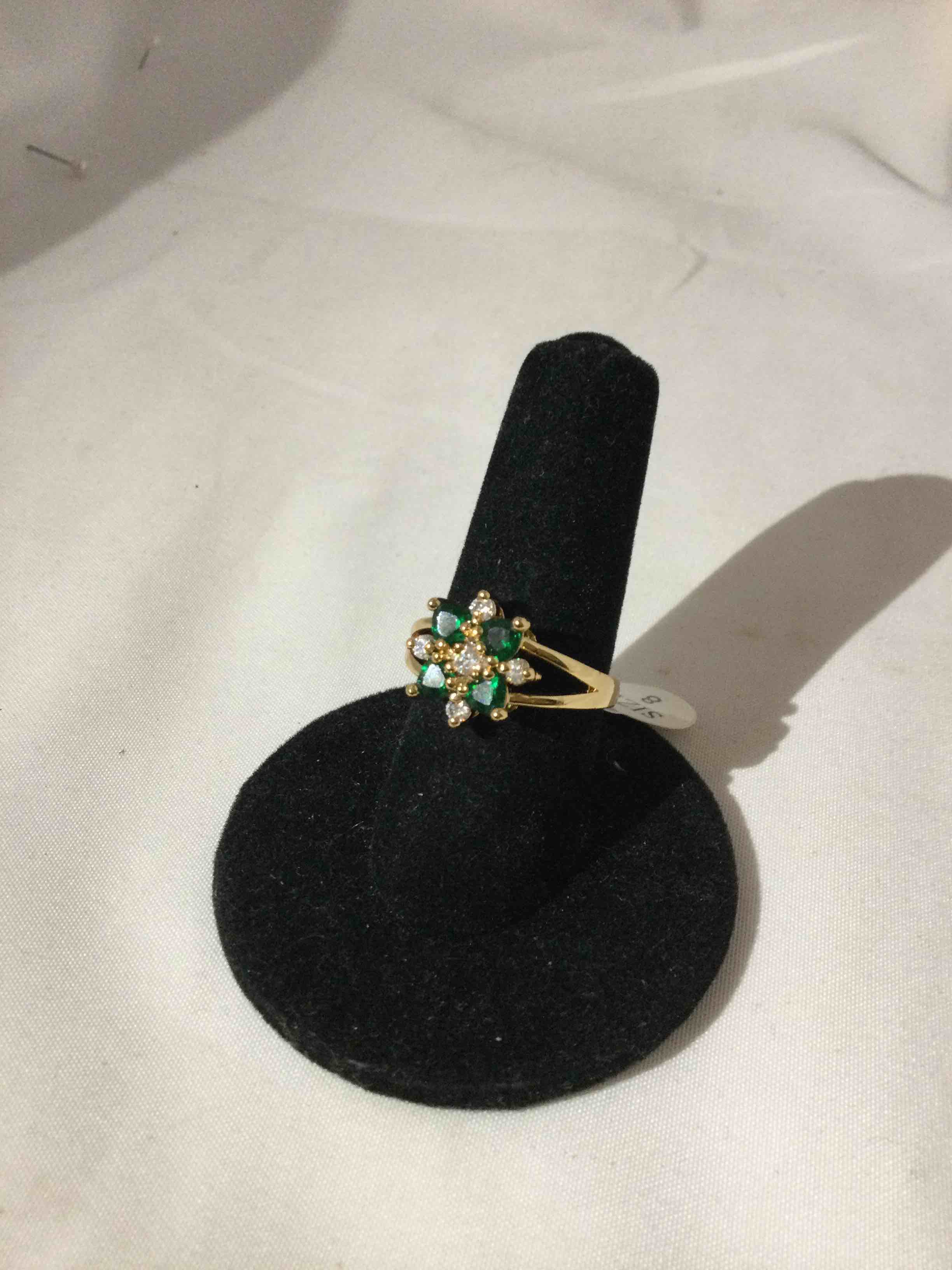 Condition photo showing New/Like New for emerald and white topaz ring