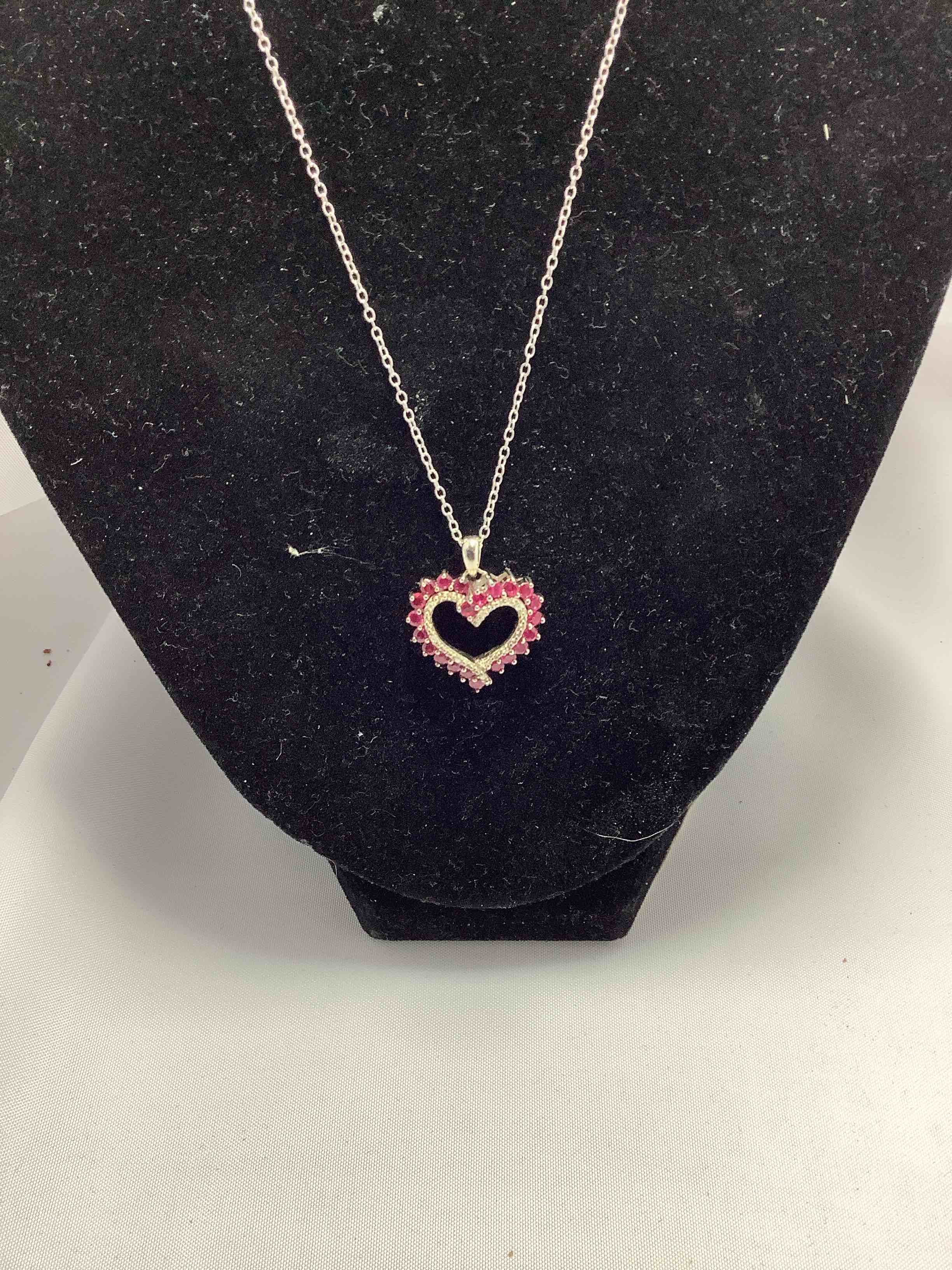 Condition photo showing New/Like New for pink sapphire heart necklace