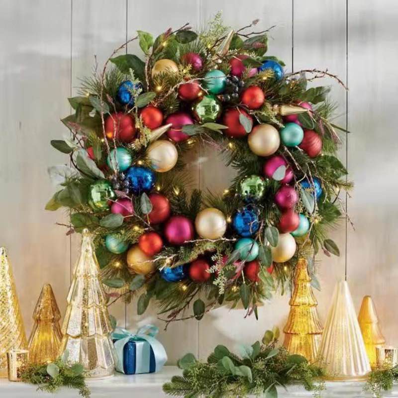 artificial christmas wreath with gold, green, and red ornaments, glittering gold leaf steams for front door, xmas wreath for holiday christmas decorations