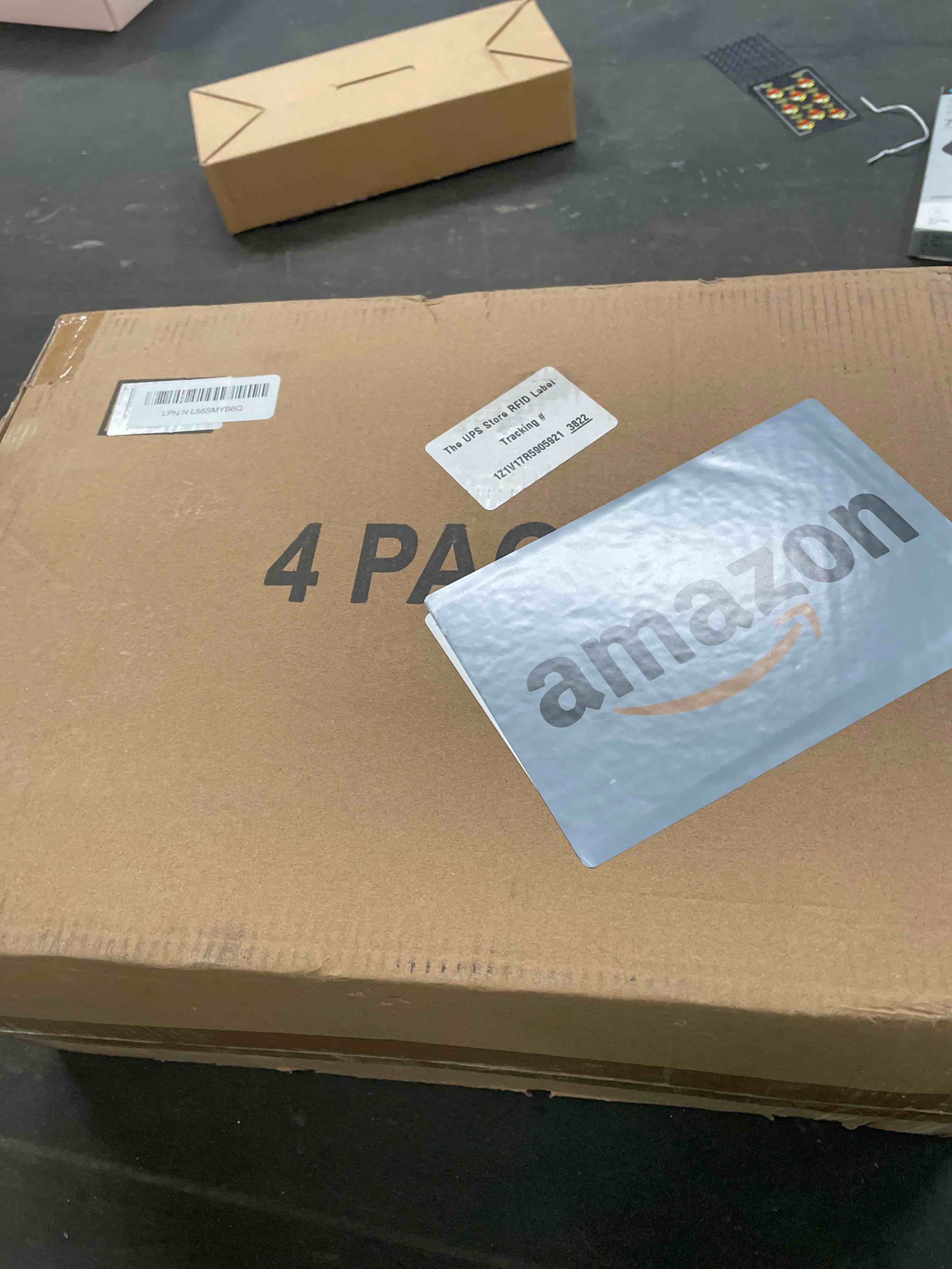 Condition photo showing Good Condition for 4 Tier Plastic Storage Bins with Lid 23QT, Stackable Storage Containers with Wheels, Folding Storage Boxes, Collapsible Storage Bins, Closet Organizers and Storage for Living Room,Office,Dorm 4-Tier 23QT