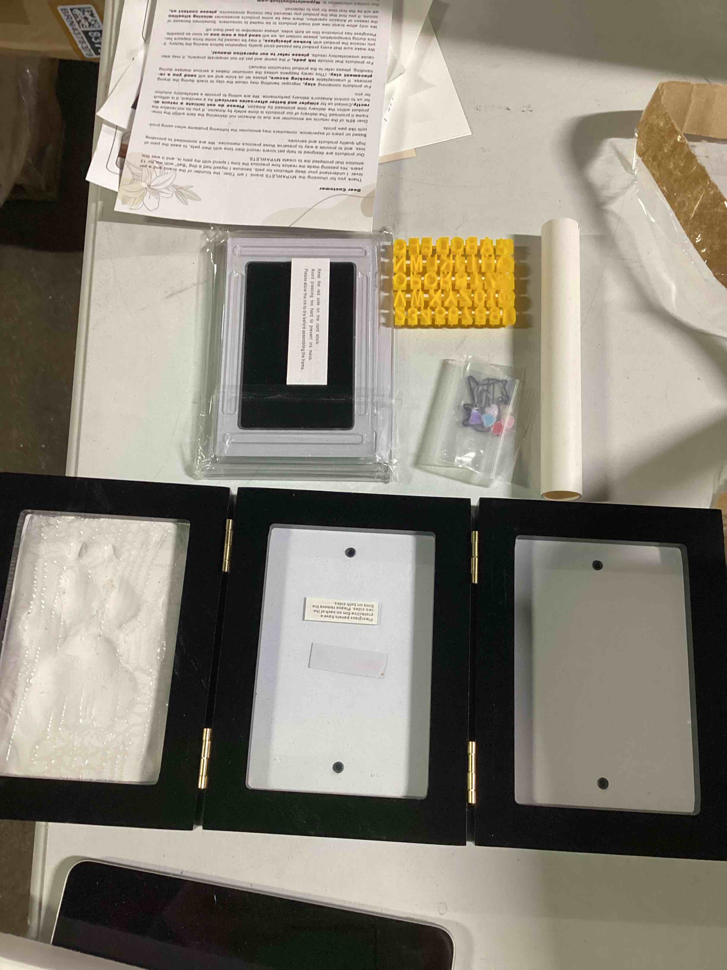 Condition photo showing As Is for (used)MYPAWLETS Ink&Clay Paw Print Kit Keepsake,Inkless Ink Pad & Soft Clay for Dogs/Cats Paw Prints,Pet Paw Print Impression Kit,Paw Print Stamp Pad for Dogs or Cats,DIY Gifts for Pet Owners-Black