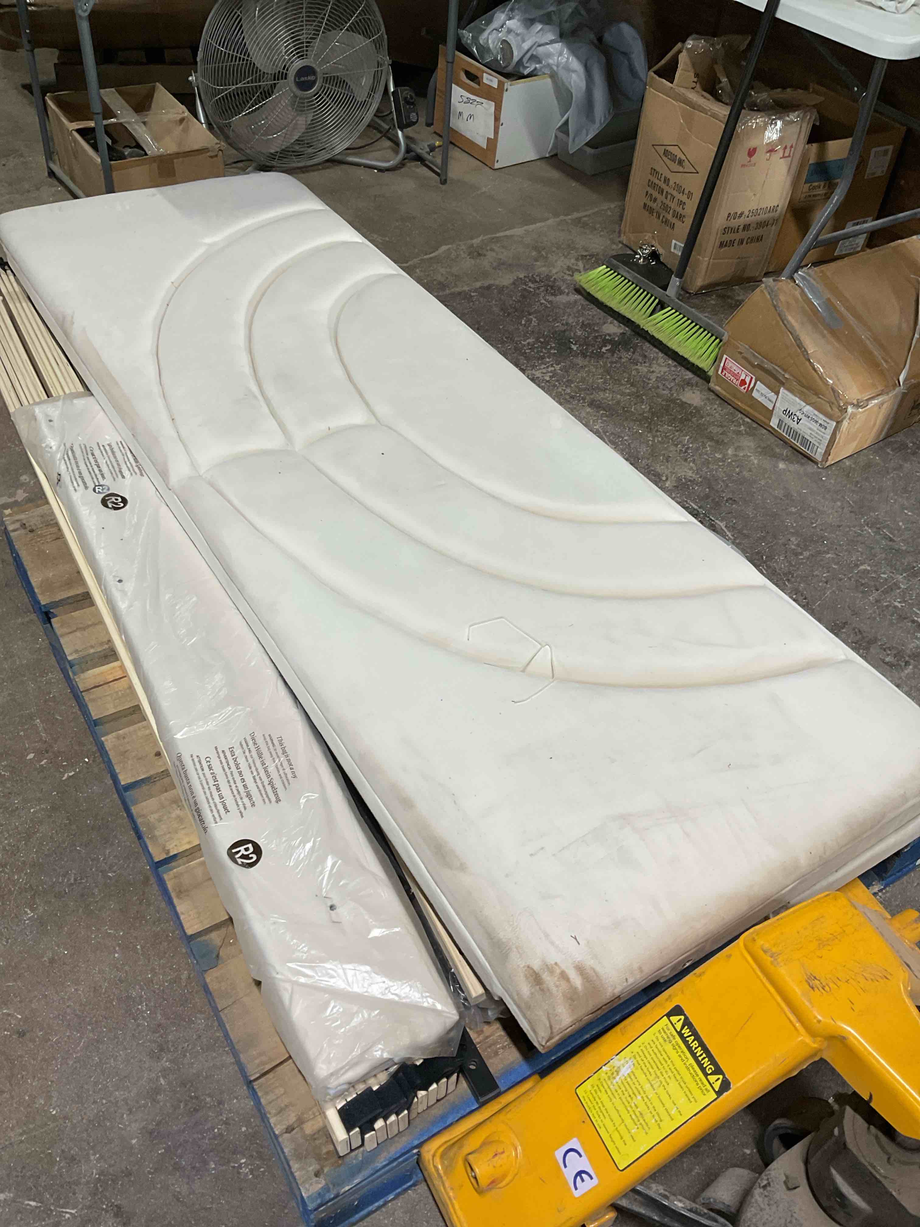 Condition photo showing As Is for Beige King Sized Bed with Fabric Headboard.