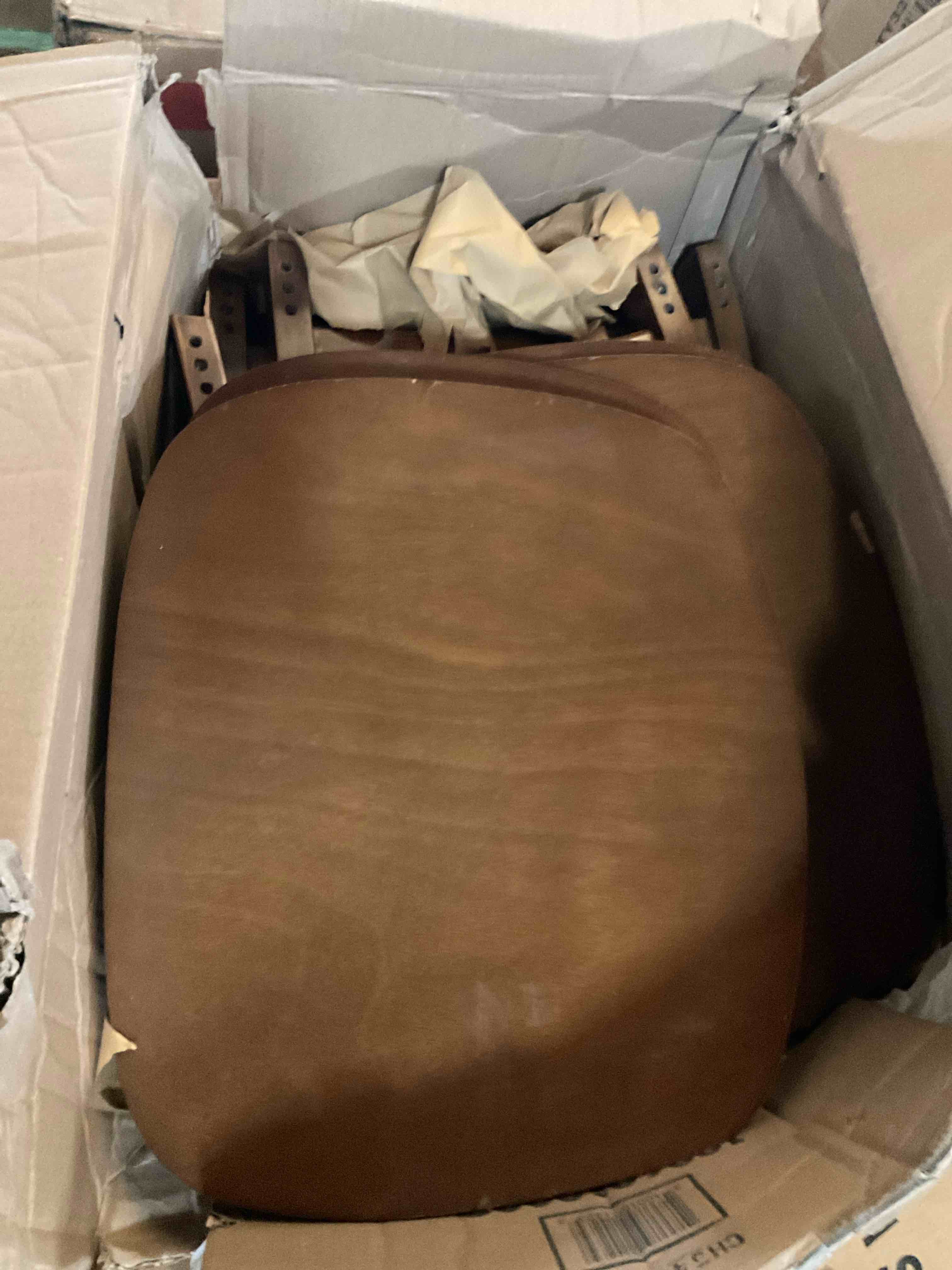 box of miscellaneous chair pieces