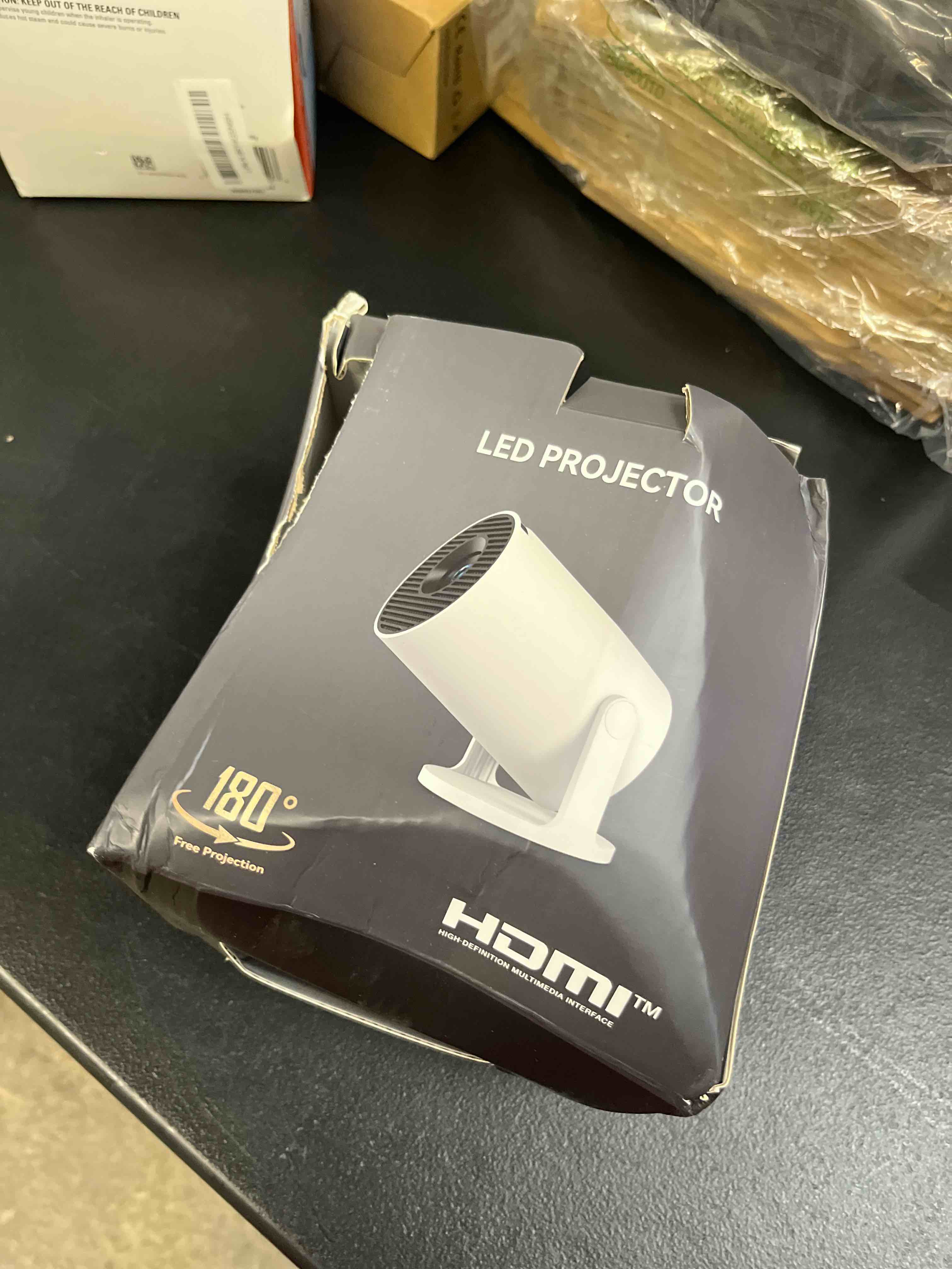Condition photo showing Good Condition for mini portable projector 4k wifi 6 bt 5.2 upgraded portable projector full hd supported for phone /pc /tv /hdmi /ps5 /laptop auto keystone home theater 180° rotation [built-in app] white