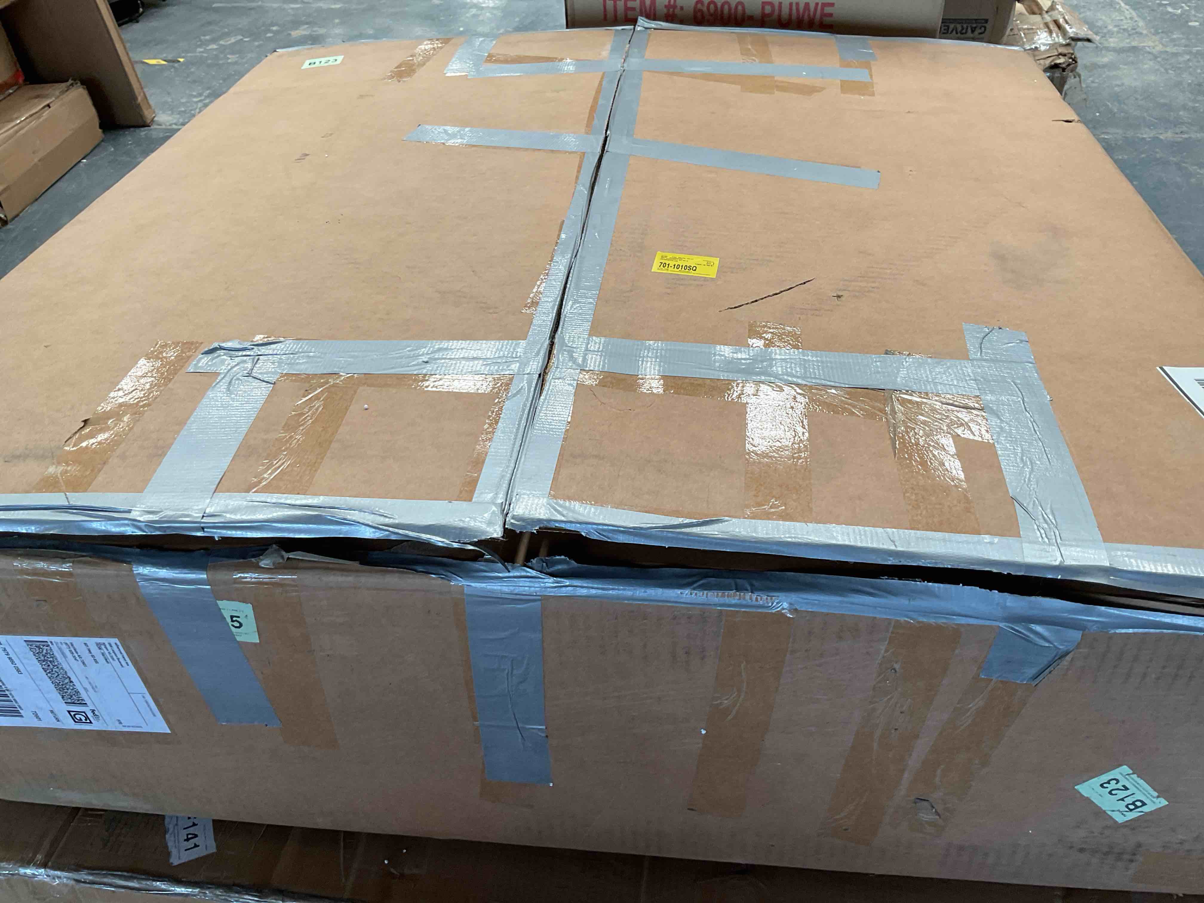 Large round wooden table with a raise lip and beveled base with removable glass lazy Suzan 