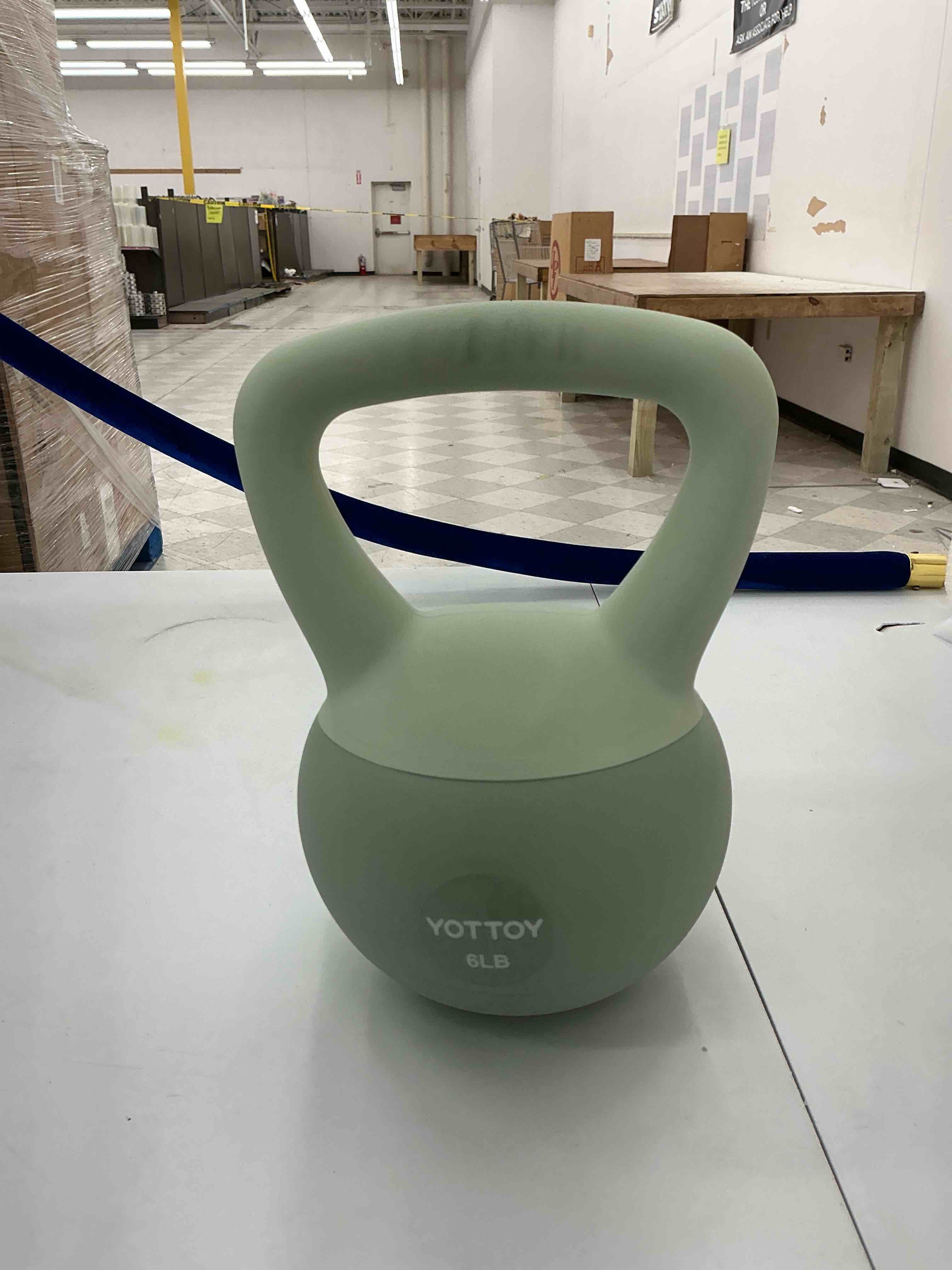 One Light green six pound weight 