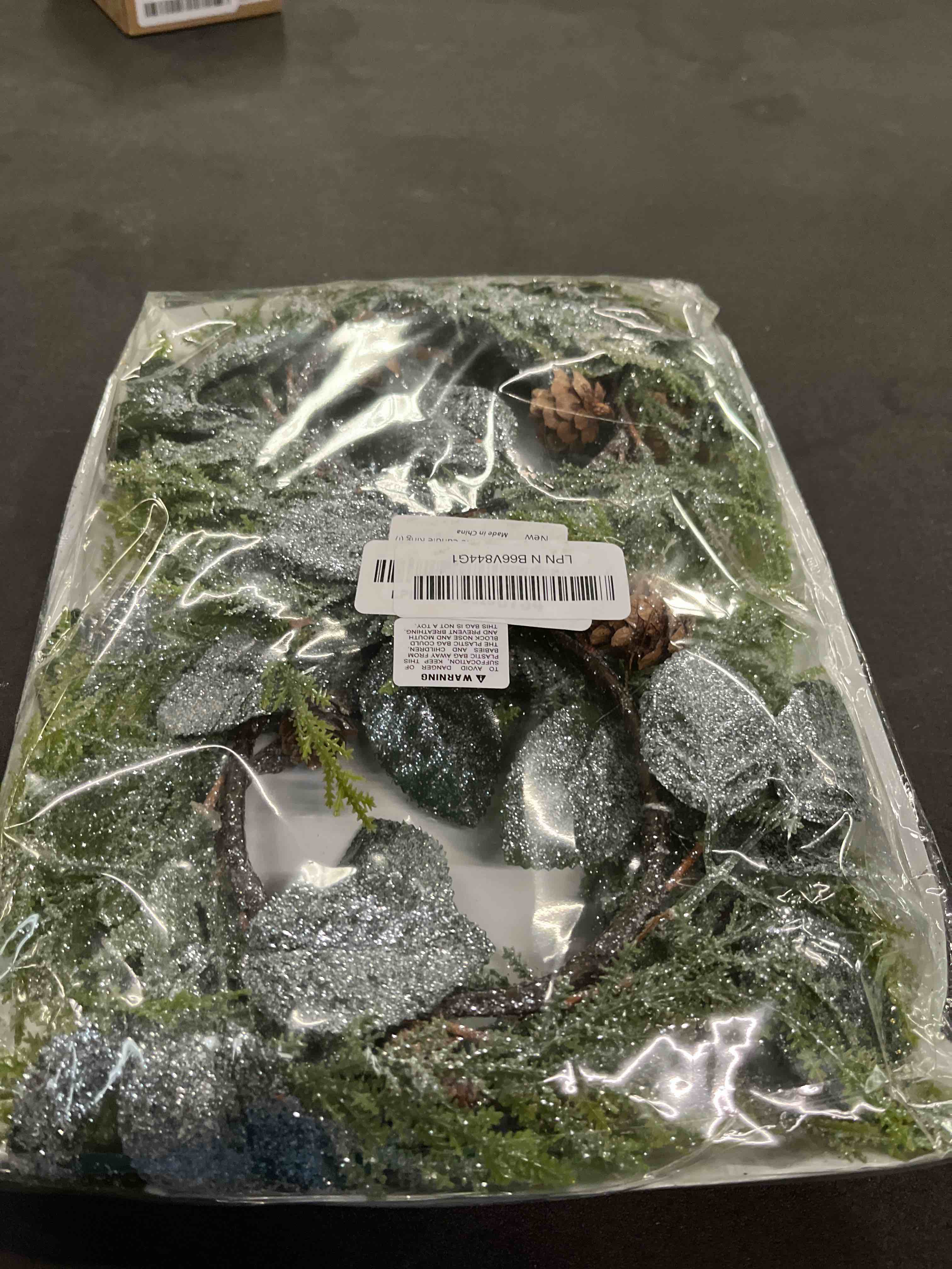Condition photo showing Good Condition for Winlyn 4 Pcs Frosted Artificial Pine Candle Rings Christmas Candle Holder Rings Small Faux Pine Wreaths with Pinecones and Green Leaves 11.8" for Farmhouse Holiday Winter Mantel Kitchen Cabinet Décor