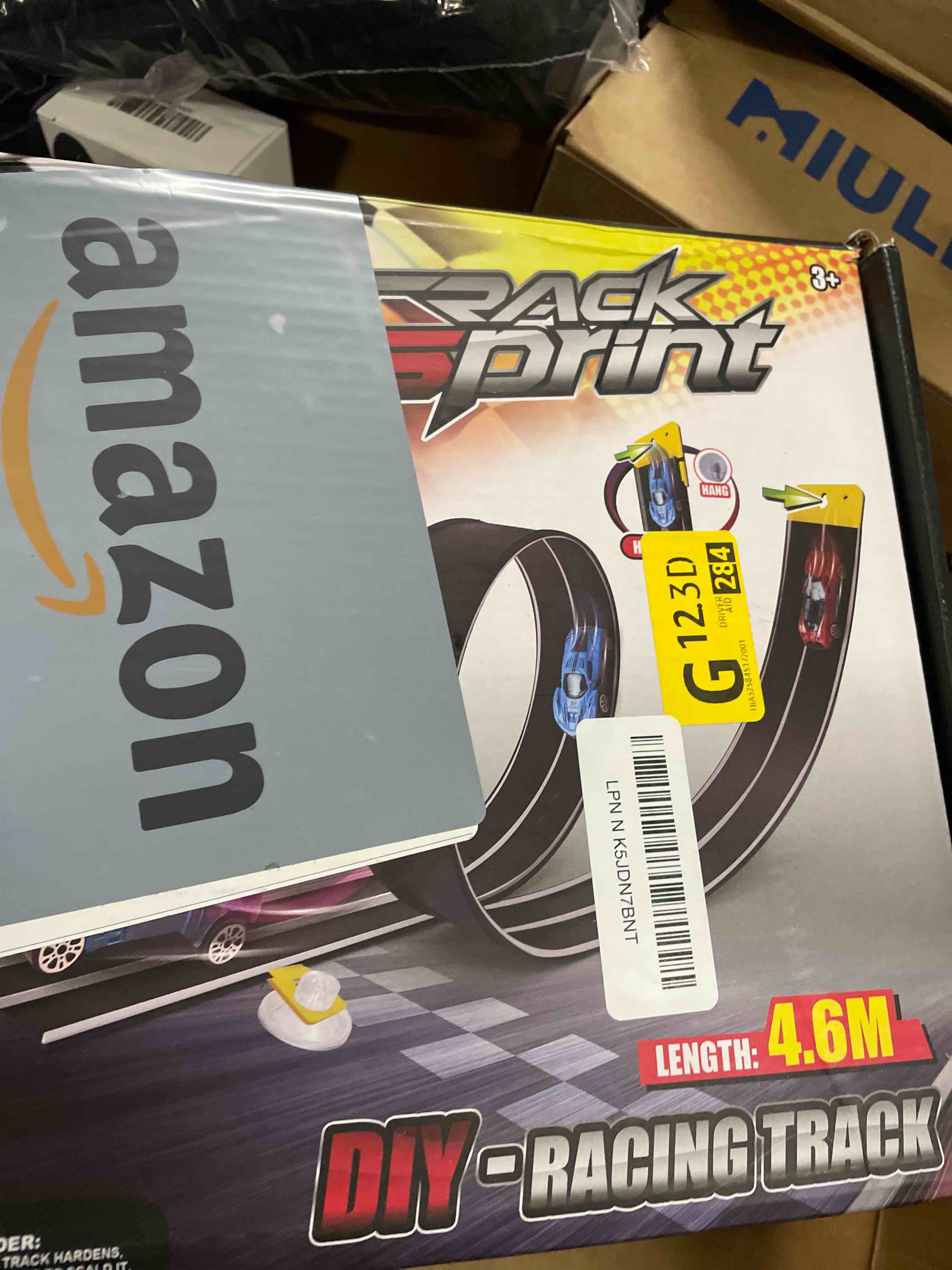 Condition photo showing Good Condition for Flexible Race Track Toys for Kids 15 Ft with 4 Cars & Suction Cups, Portable Double Lane Racetrack Compatible with Hot Wheels & 1/64 Diecast Cars, Fun Car Ramp Track Set for Ages 3+(Orange & Blue)